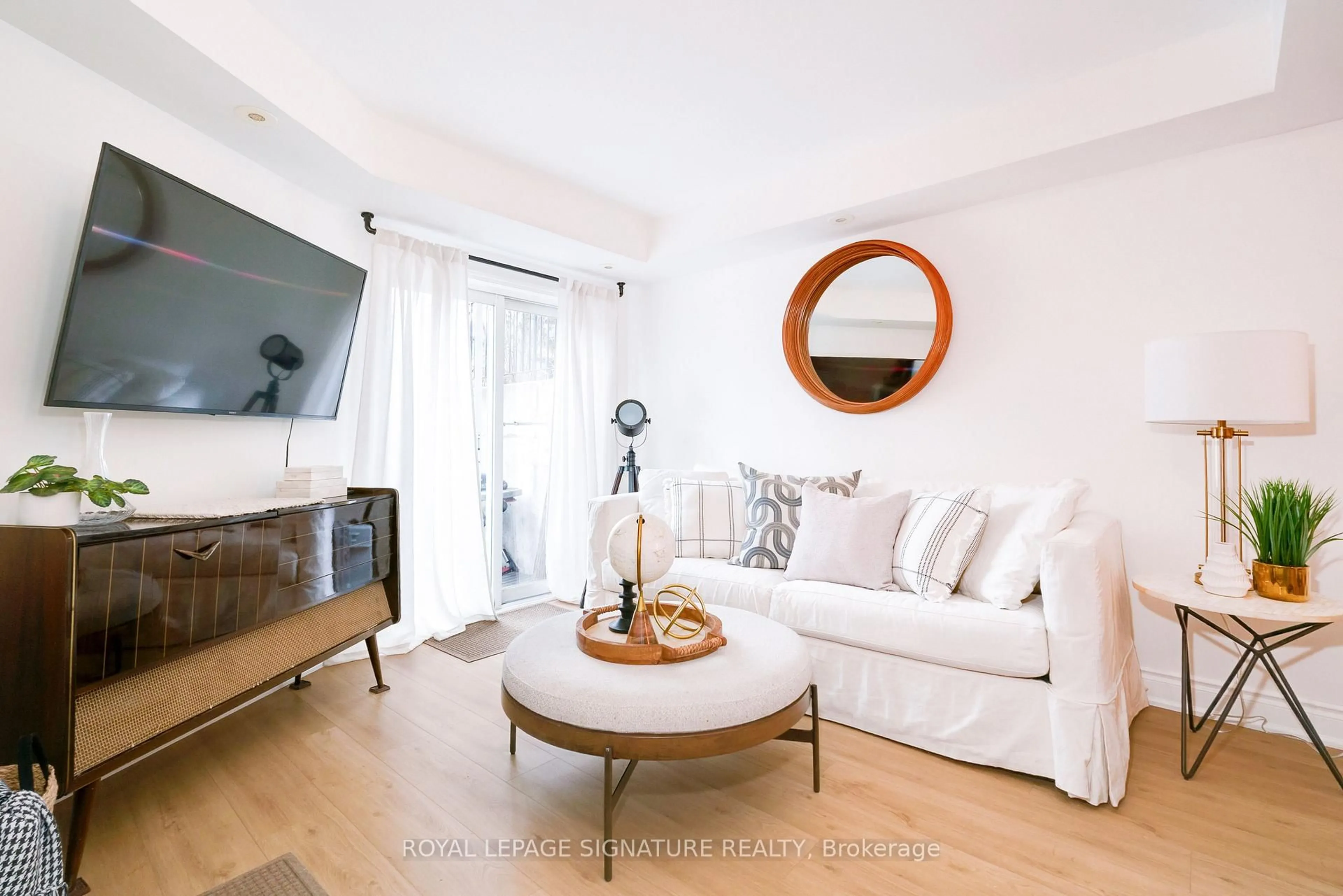 Living room with furniture, wood/laminate floor for 28 Laidlaw St #1602, Toronto Ontario M6K 1X2