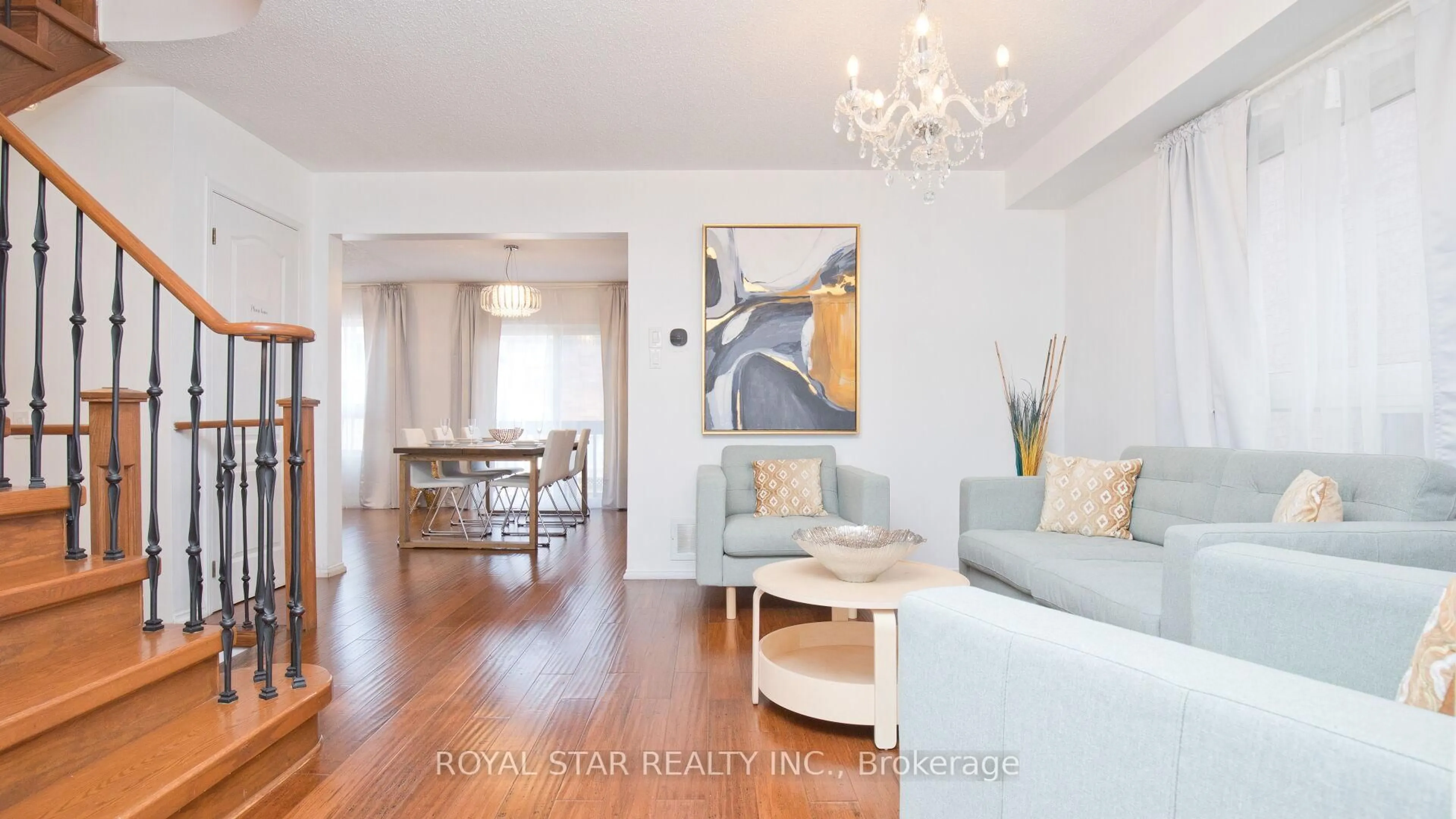 Living room with furniture, wood/laminate floor for 13 Waterdale Rd, Brampton Ontario L7A 1S7