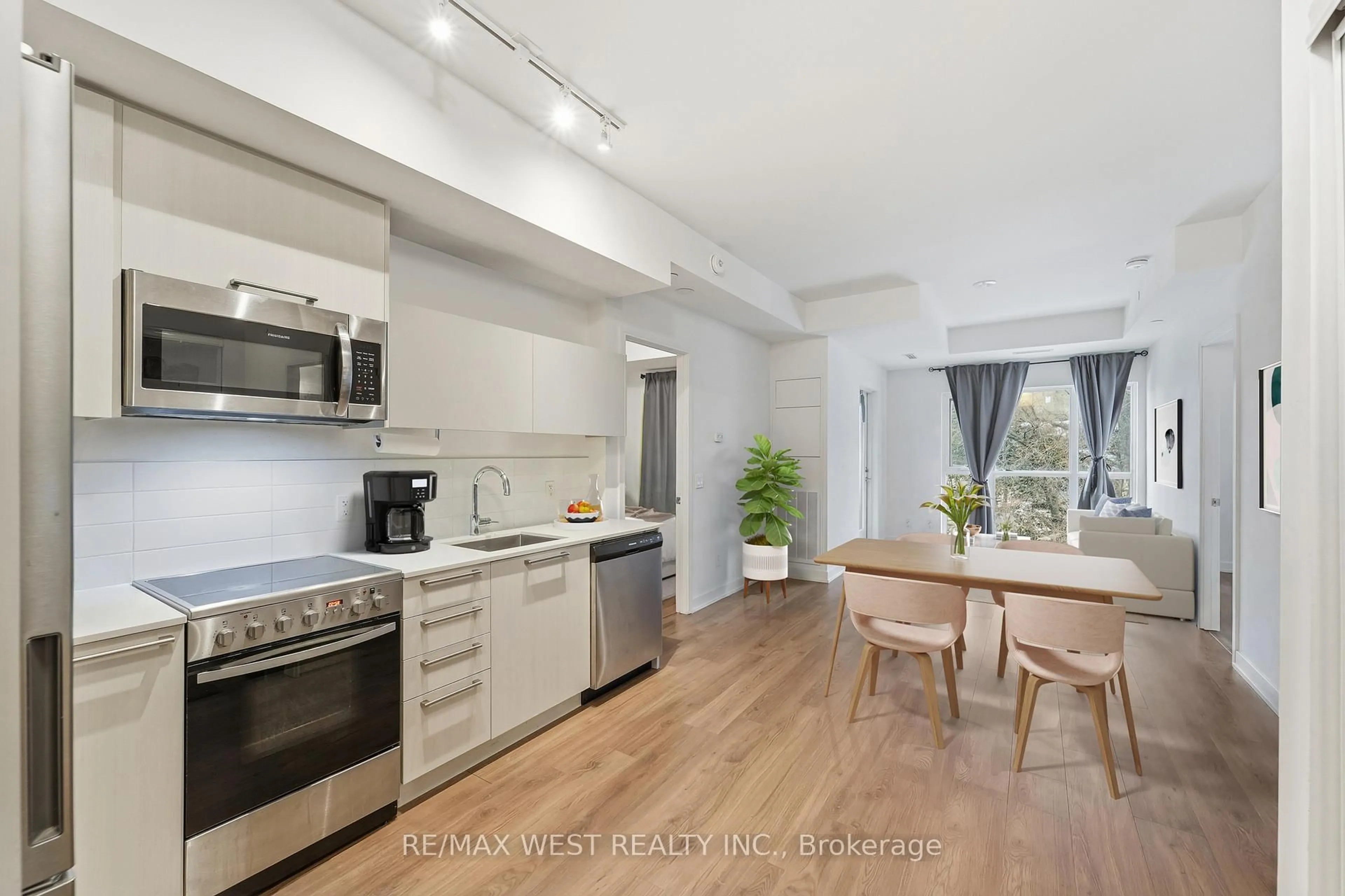 Open concept kitchen, unknown for 25 Neighbourhood Lane #306, Toronto Ontario M8Y 0C4