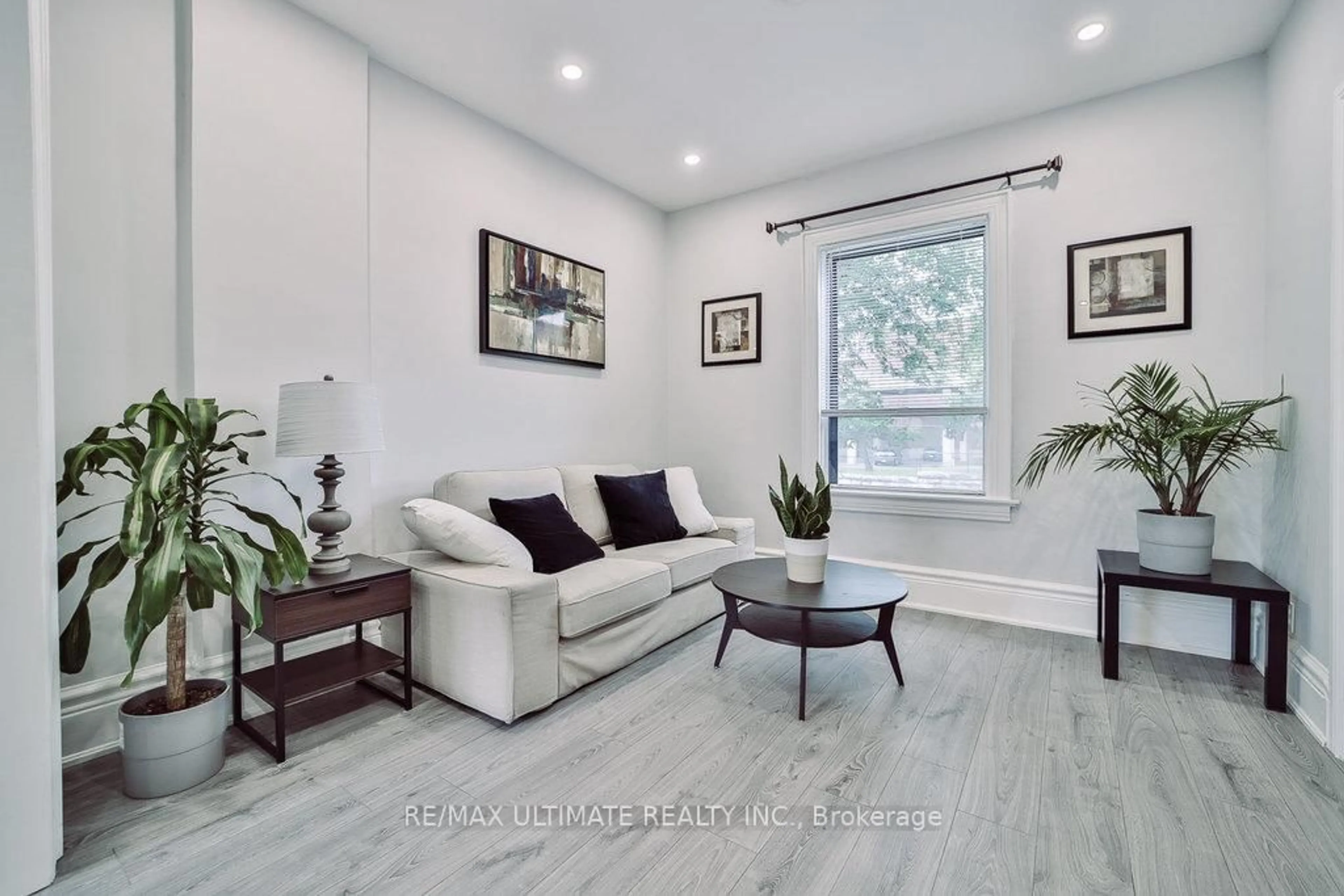 Living room with furniture, wood/laminate floor for 493 Keele St, Toronto Ontario M6N 3E1