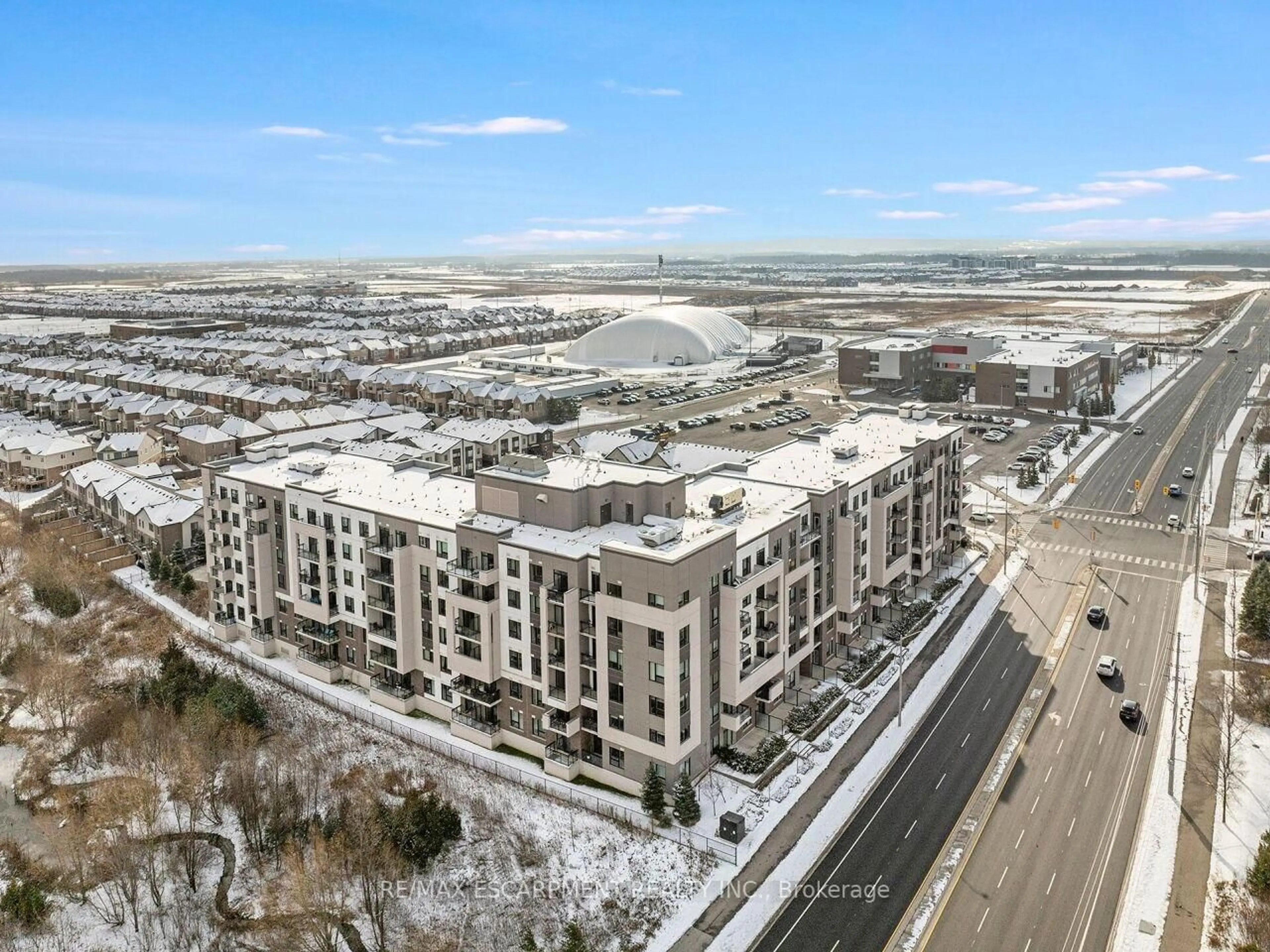 A pic from outside/outdoor area/front of a property/back of a property/a pic from drone, unknown for 1105 Leger Way #412, Milton Ontario L9E 1K7