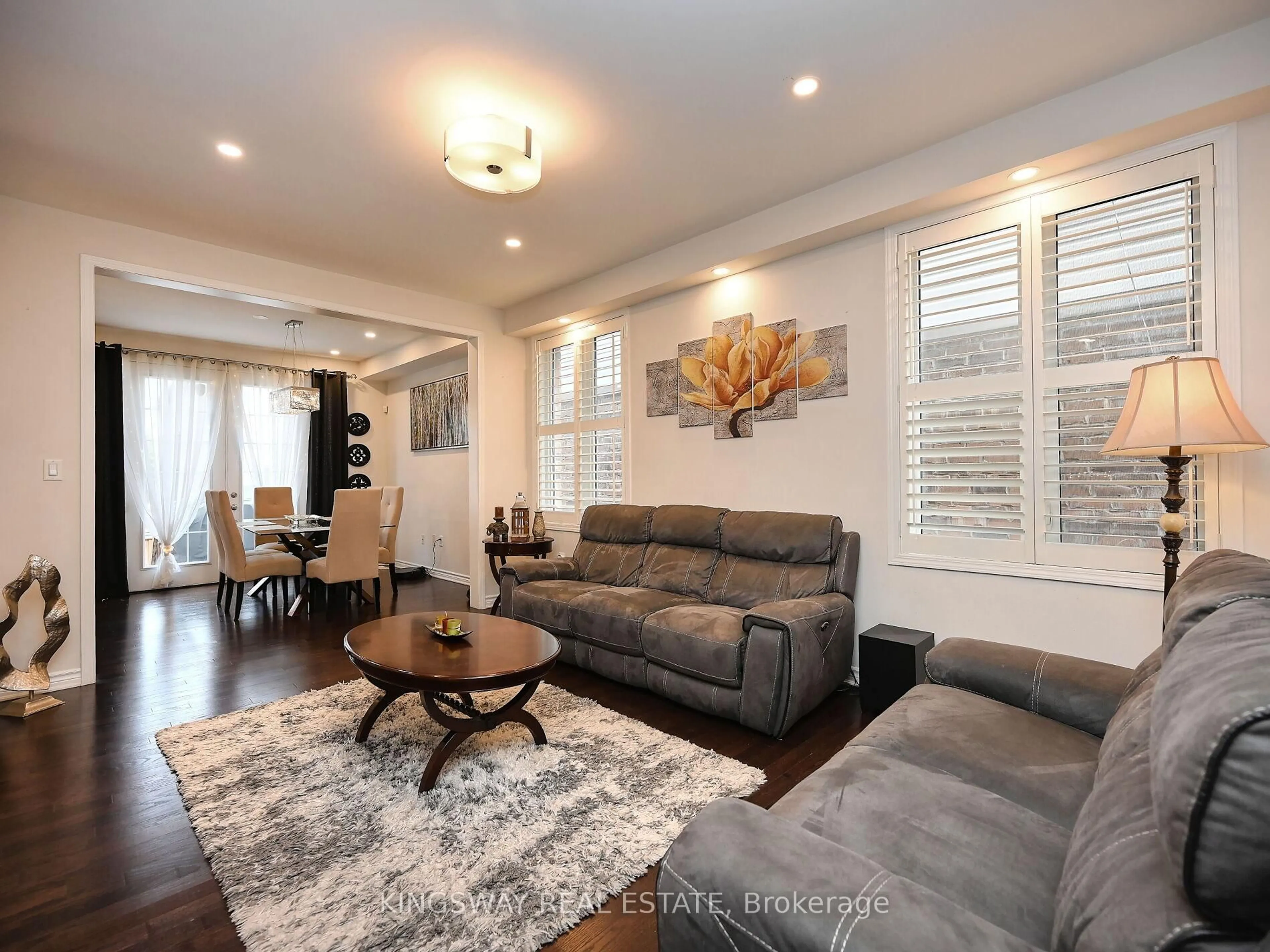 Living room with furniture, wood/laminate floor for 620 LANGHOLM St, Milton Ontario L9T 8Z8
