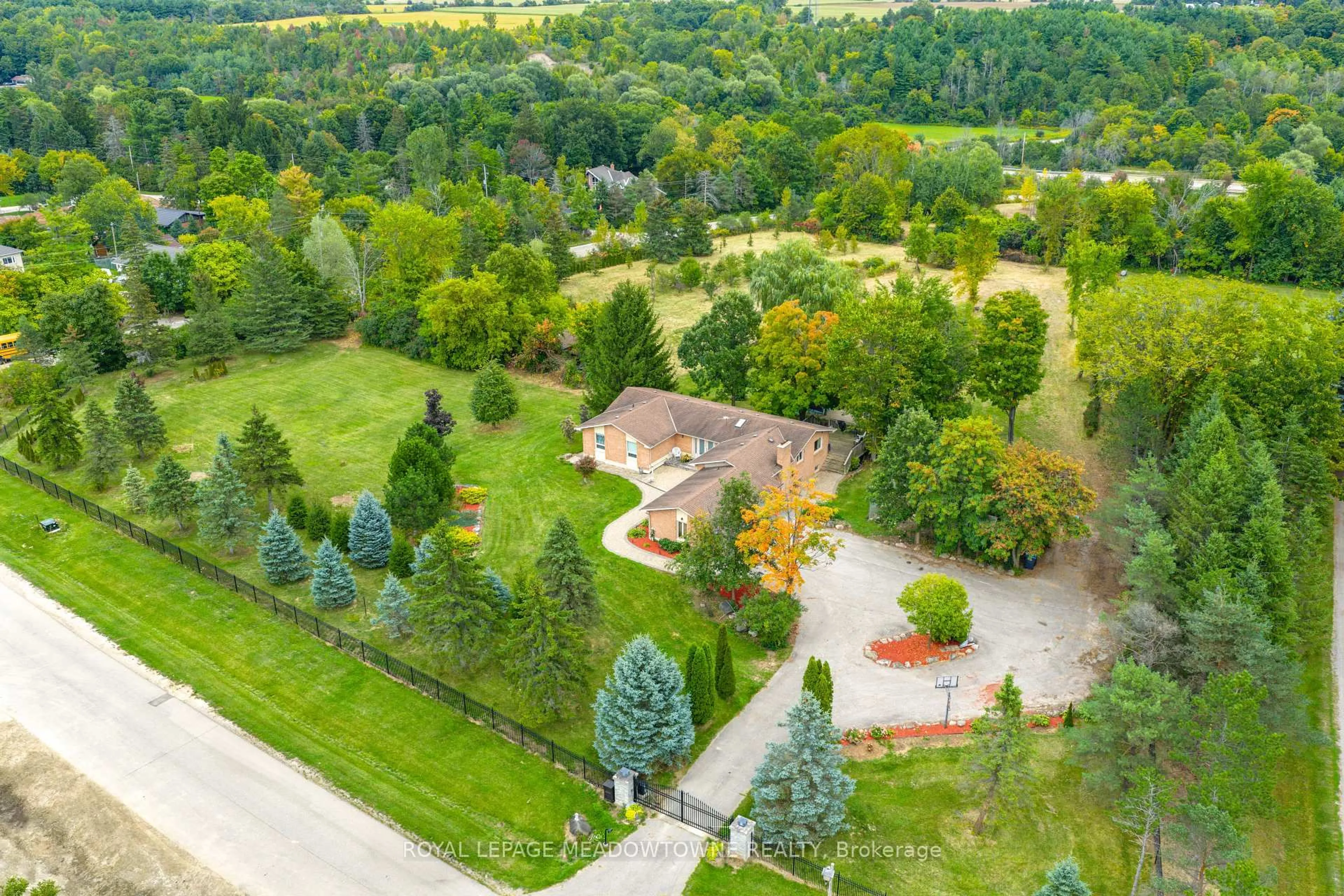 A pic from outside/outdoor area/front of a property/back of a property/a pic from drone, forest/trees view for 1 Cassidy Lane, Caledon Ontario L7C 1P5