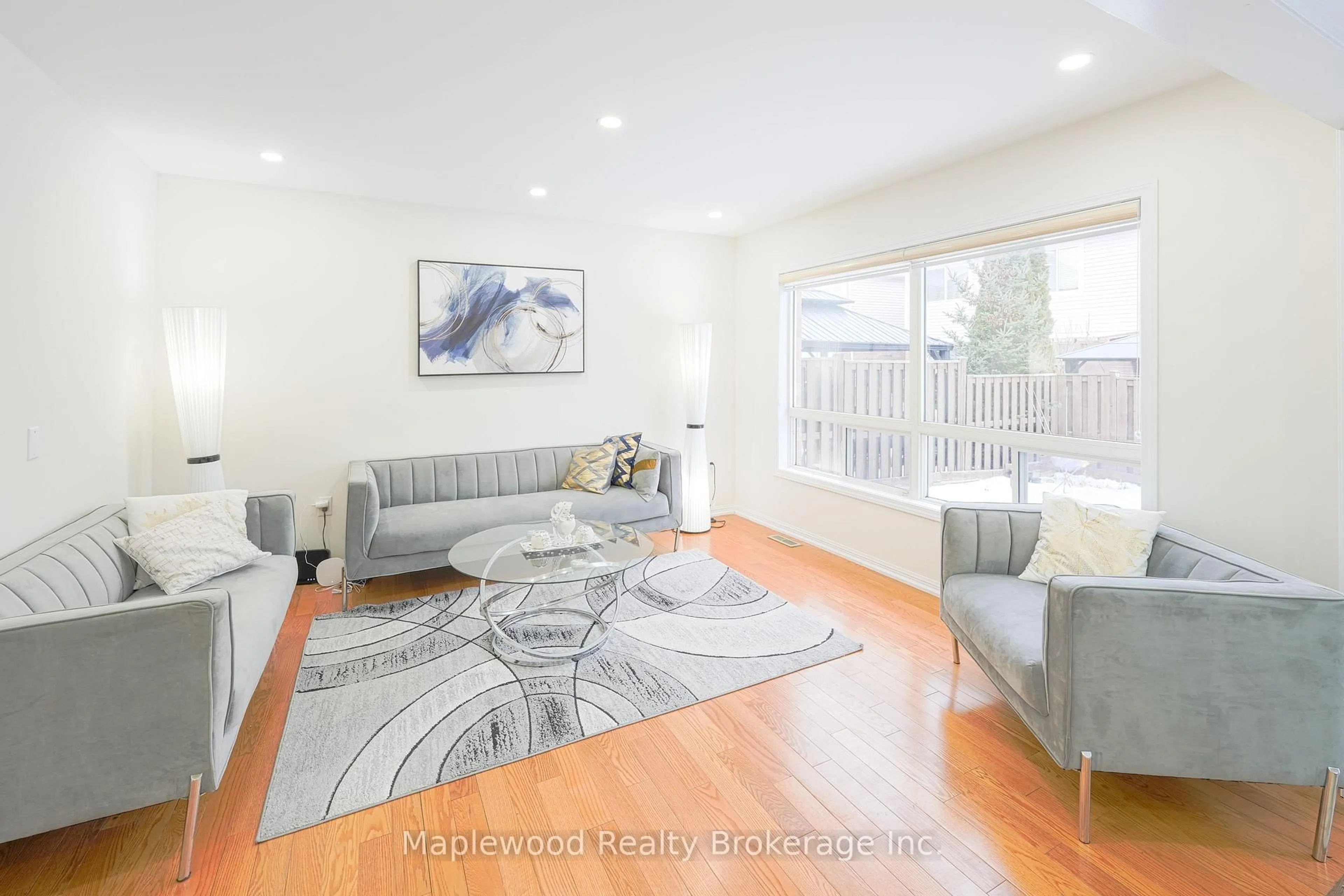 Living room with furniture, wood/laminate floor for 7 Chudleigh Ave, Brampton Ontario L6X 0N1