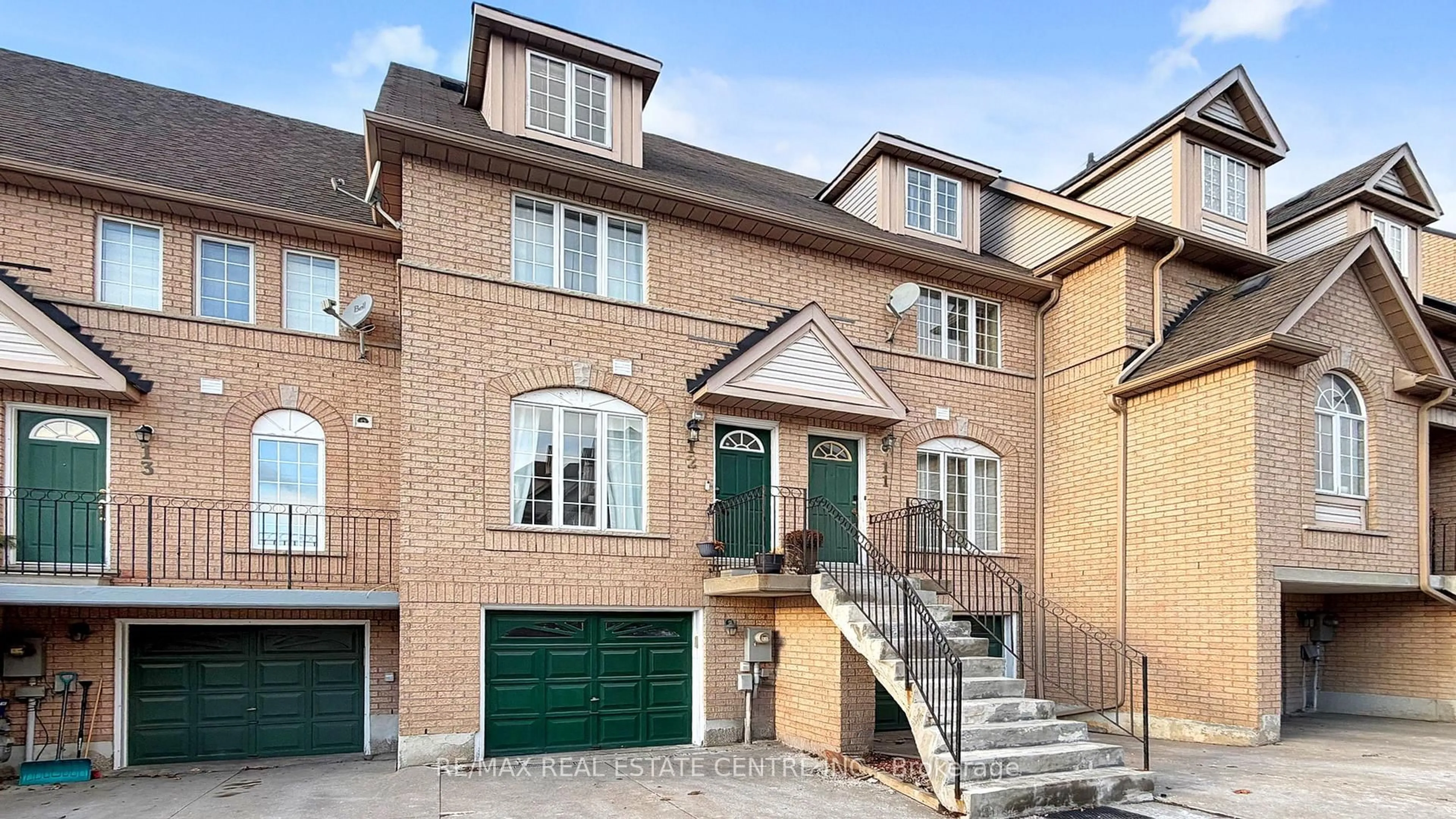 Home with brick exterior material, street for 80 Strathaven Dr #12, Mississauga Ontario L5R 3V9