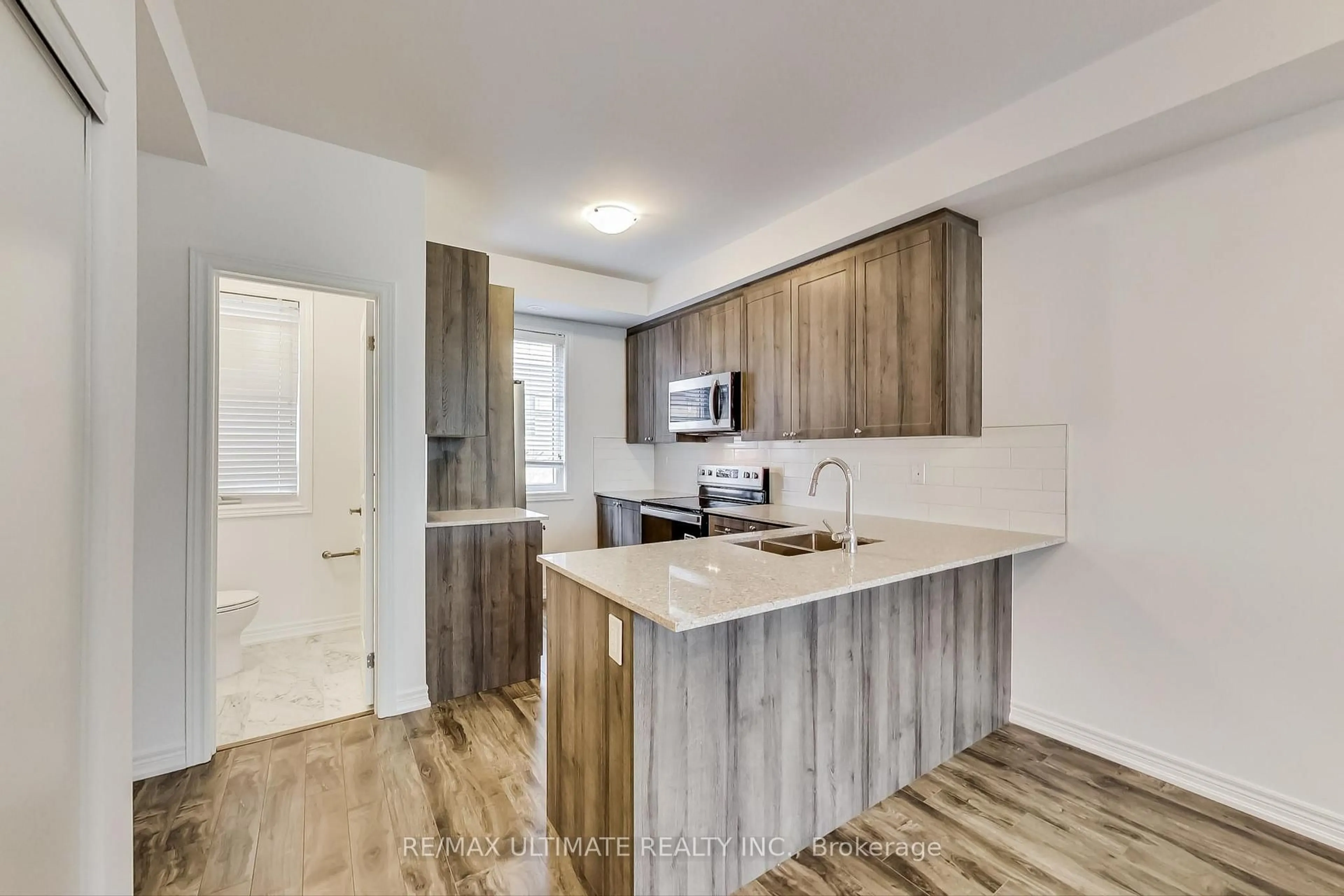 Open concept kitchen, wood/laminate floor for 370 Hopewell Ave #214, Toronto Ontario M6E 2S2