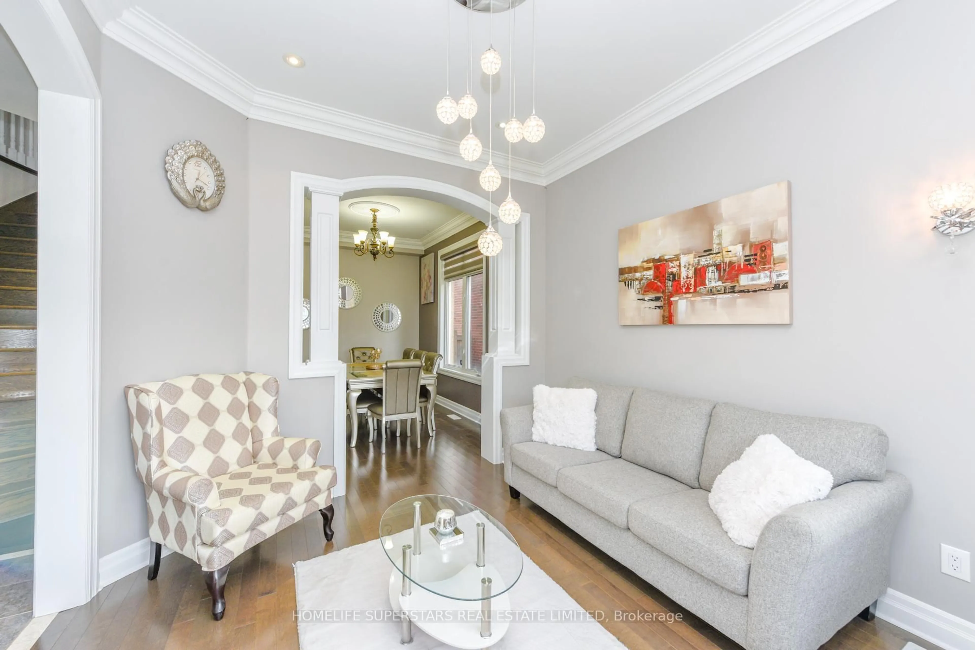 Living room with furniture, wood/laminate floor for 8 Bainsville Circ, Brampton Ontario L6P 3A5