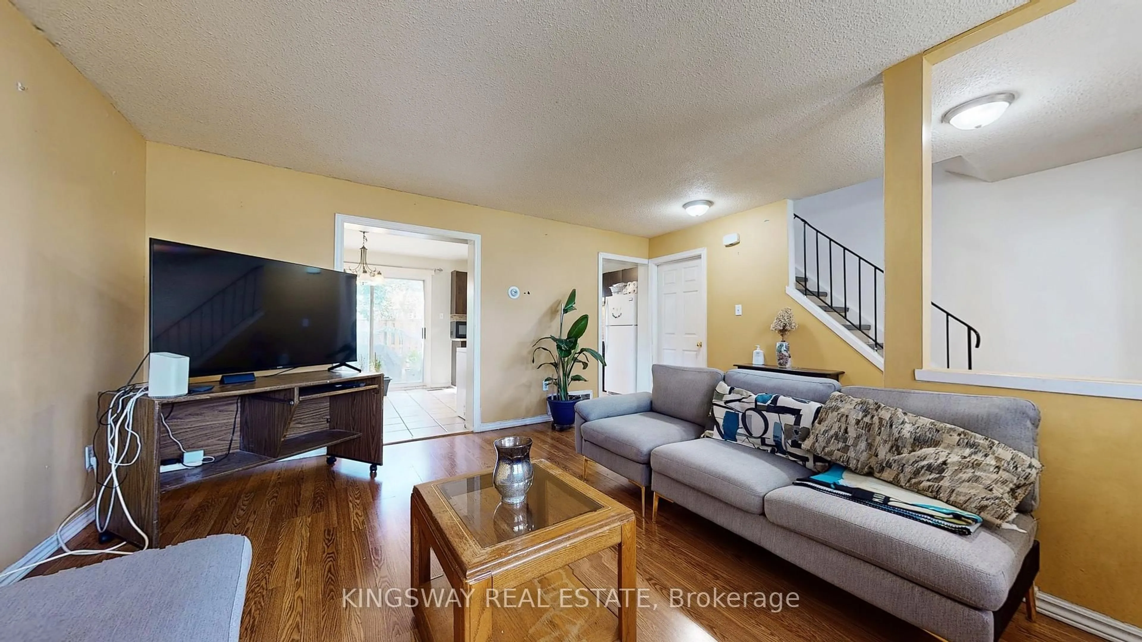 Living room with furniture, wood/laminate floor for 105 Hansen Rd #111, Brampton Ontario L6V 3C9