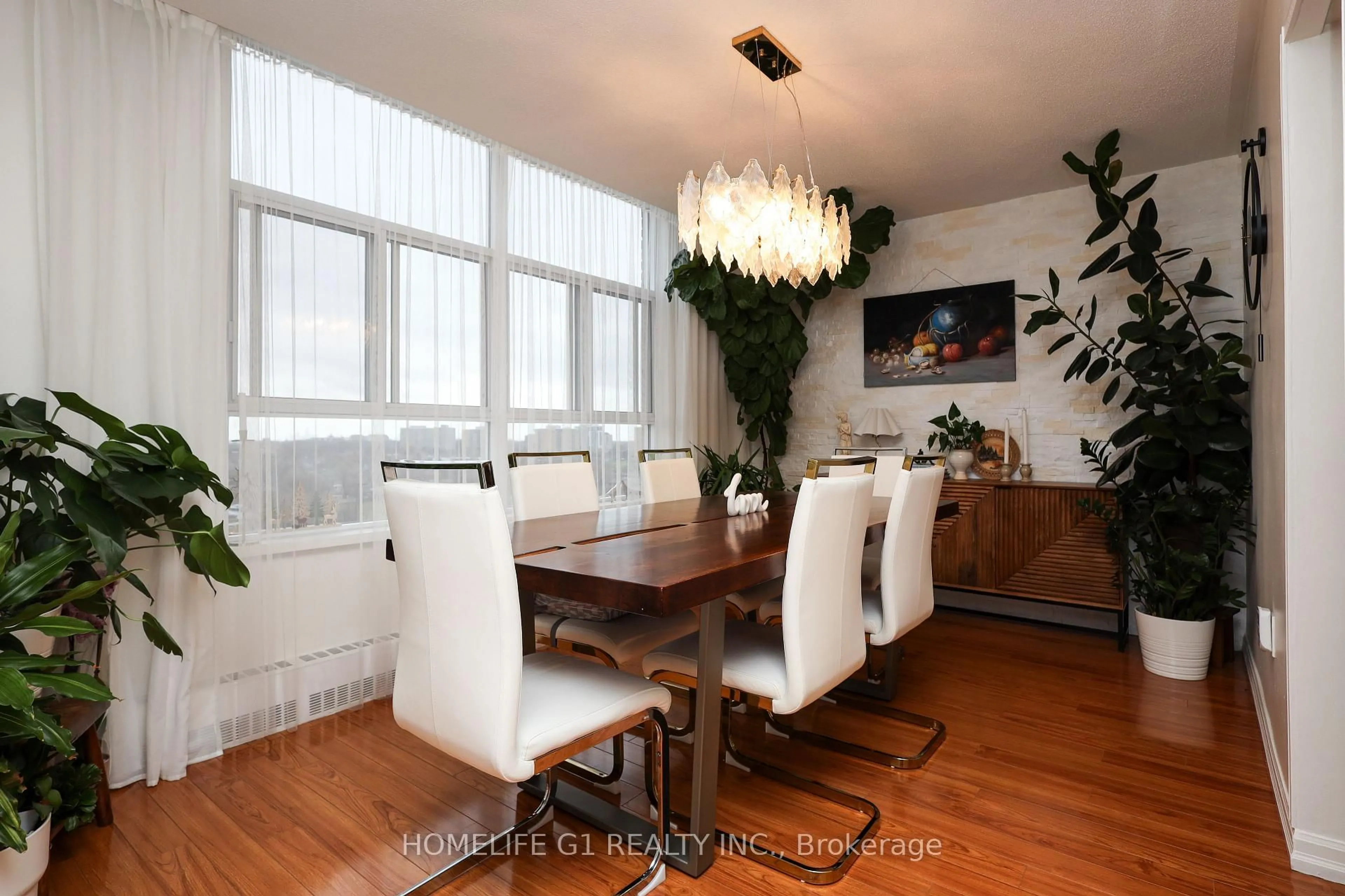 Dining room, wood/laminate floor for 44 Longbourne Dr #1203, Toronto Ontario M9R 2M7
