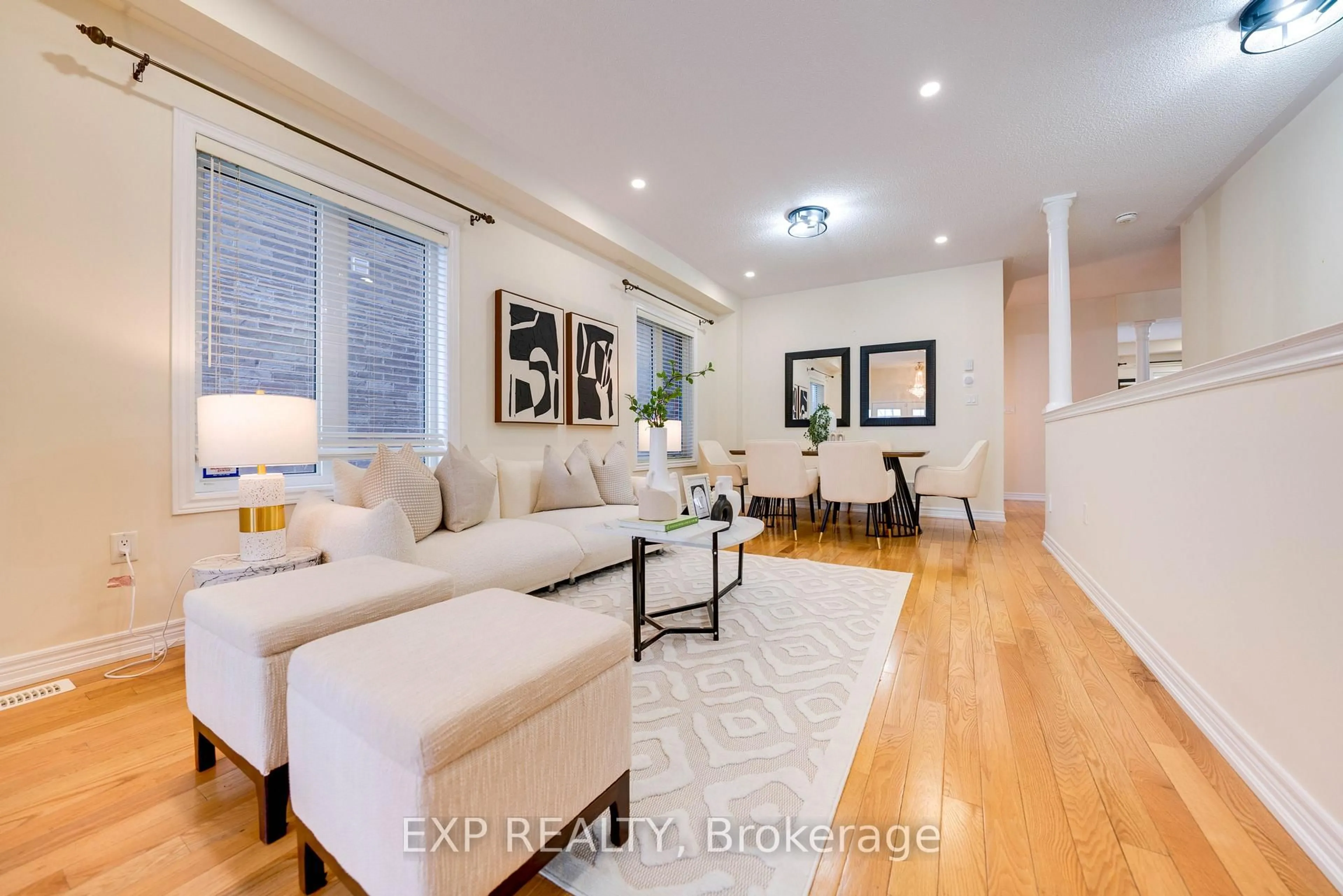 Living room with furniture, wood/laminate floor for 42 Arrowpoint Dr, Brampton Ontario L6Y 0Y8