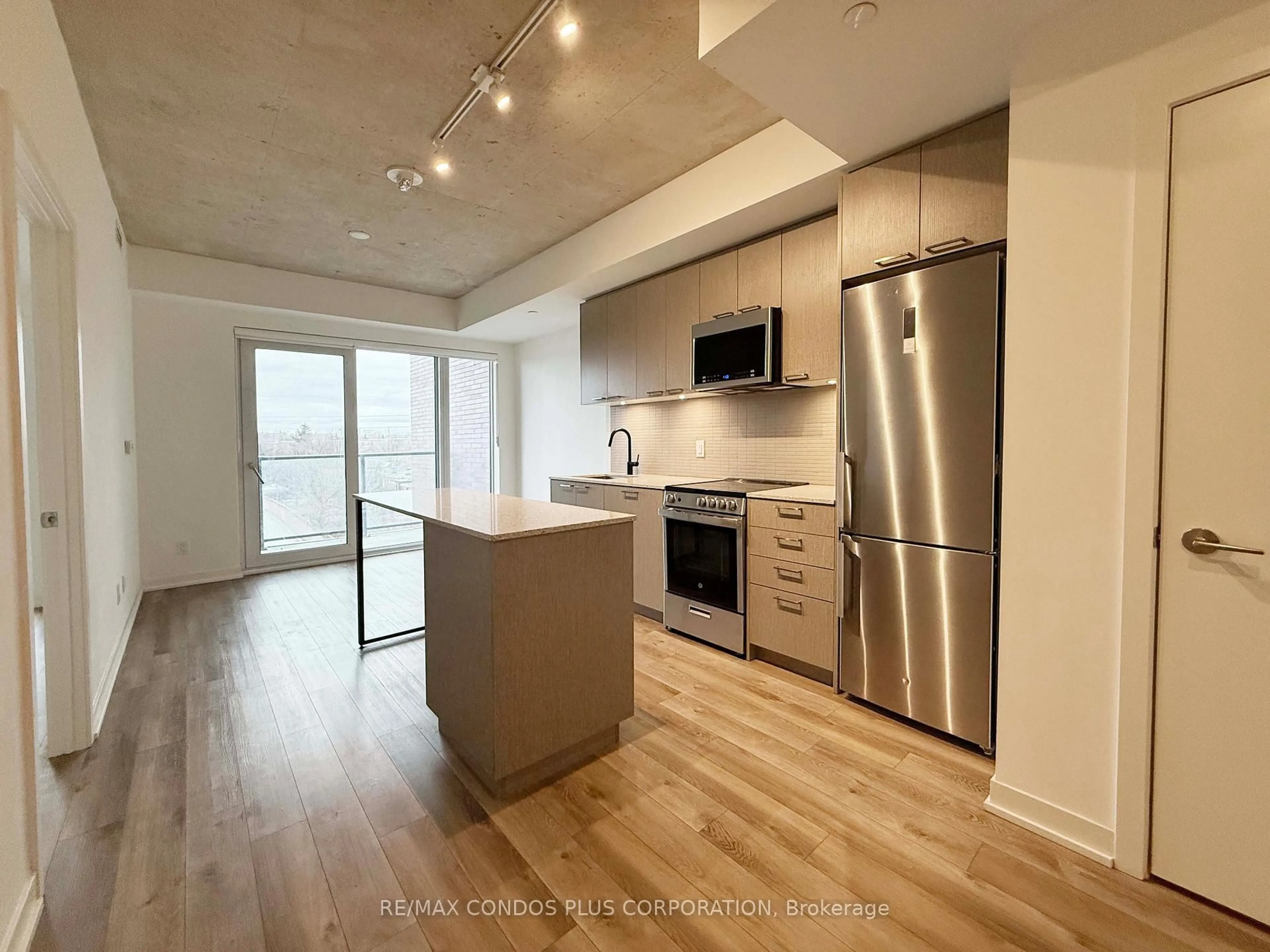 Open concept kitchen, wood/laminate floor for 1808 St Clair Ave #402, Toronto Ontario M6N 0C1