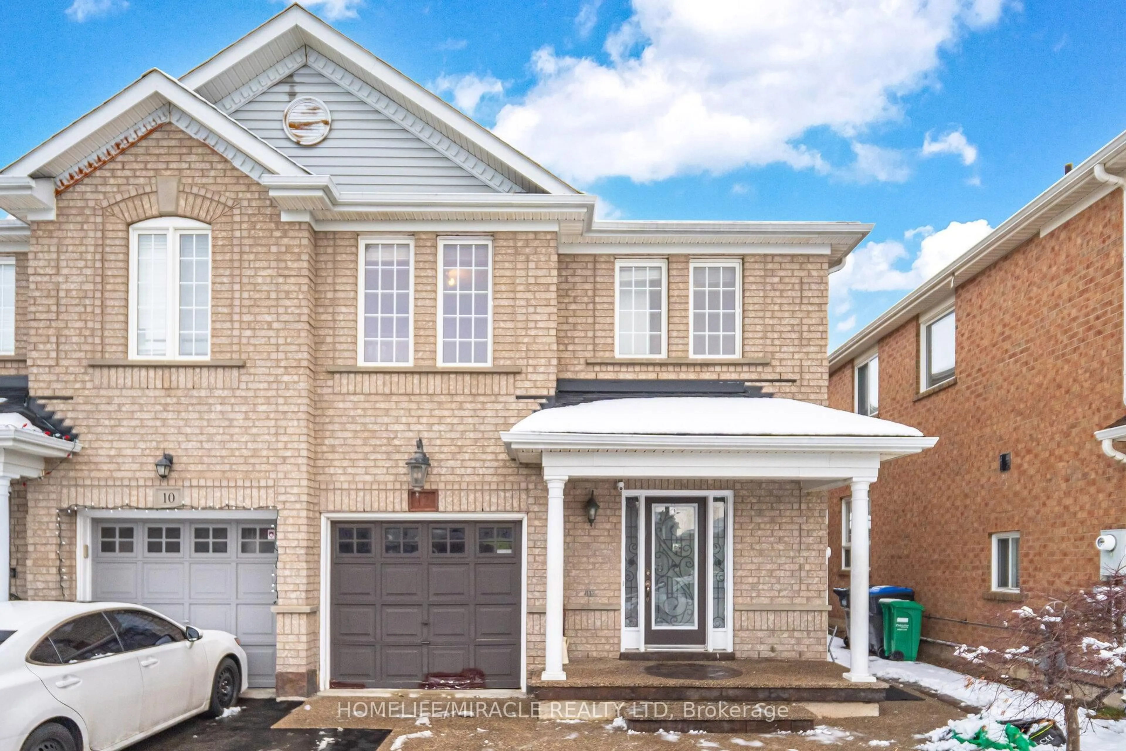 Home with brick exterior material, street for 12 Hollingsworth Circ, Brampton Ontario L7A 0J7