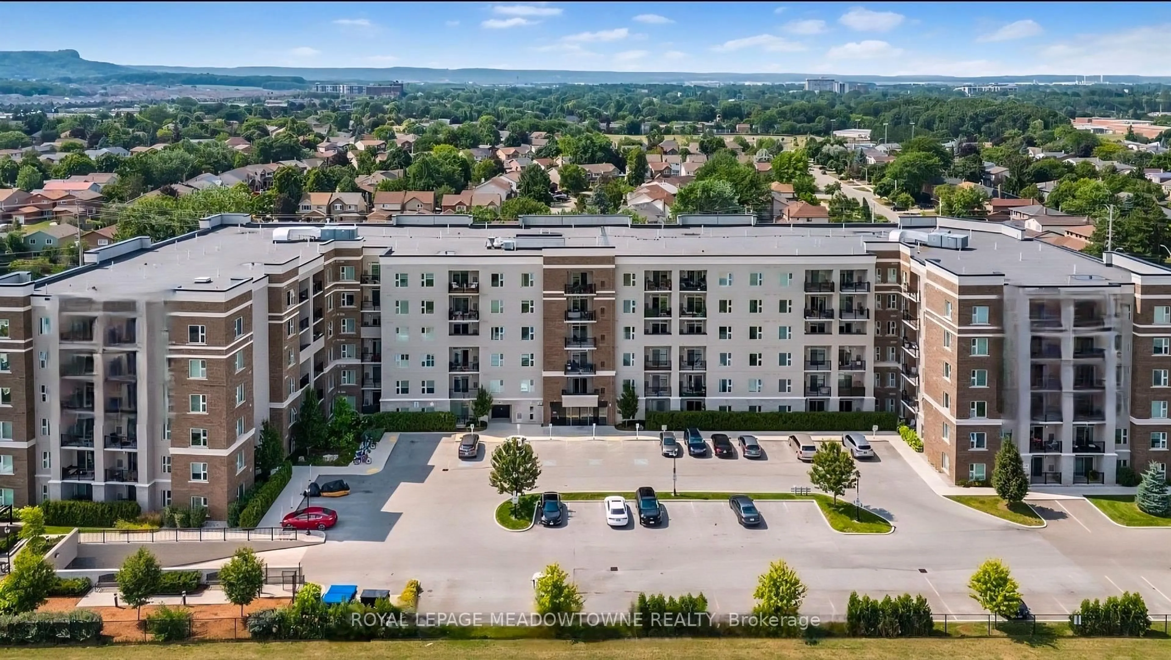 A pic from outside/outdoor area/front of a property/back of a property/a pic from drone, city buildings view from balcony for 610 Farmstead Dr #324, Milton Ontario L9T 8X5