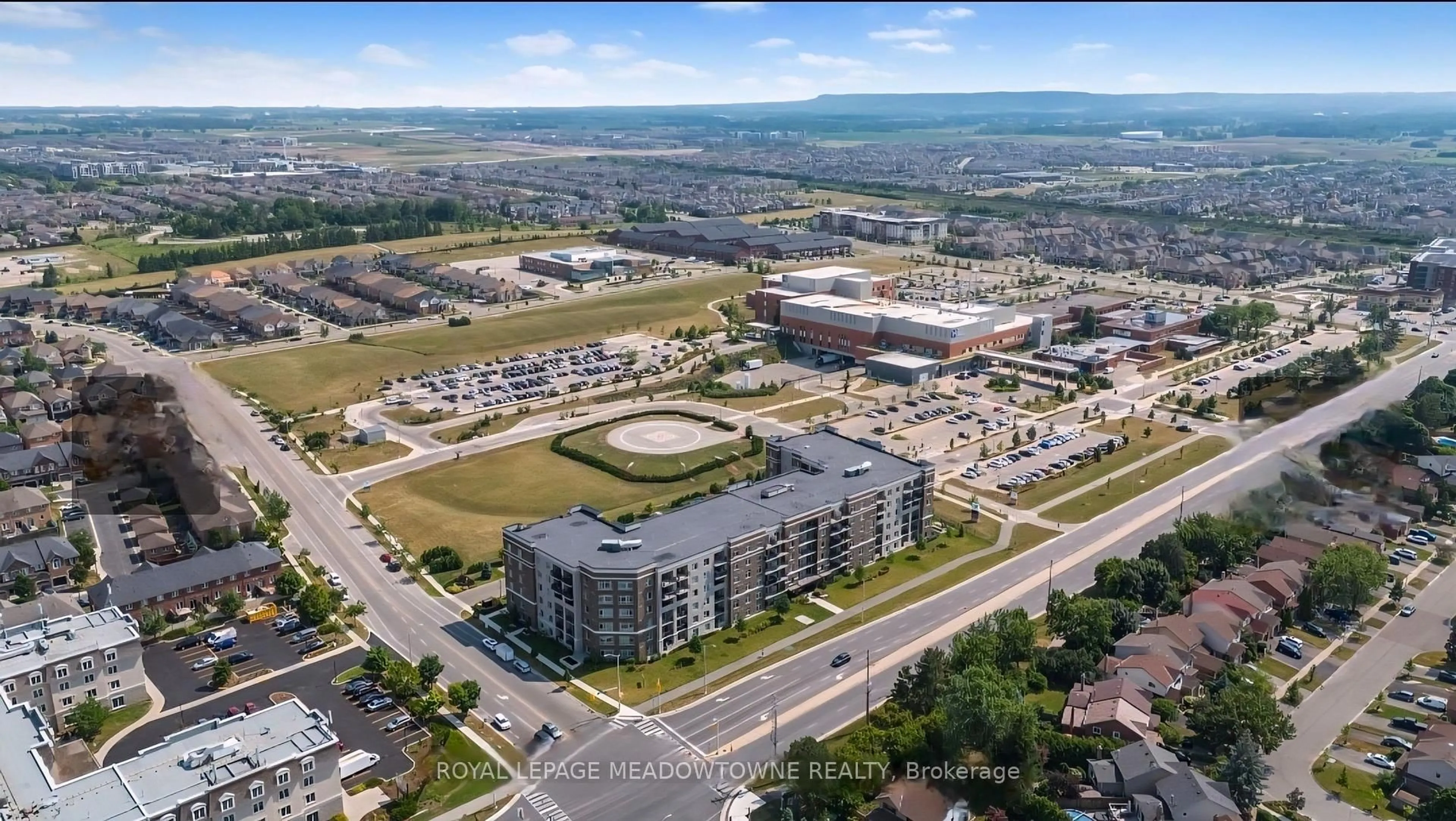 A pic from outside/outdoor area/front of a property/back of a property/a pic from drone, unknown for 610 Farmstead Dr #324, Milton Ontario L9T 8X5