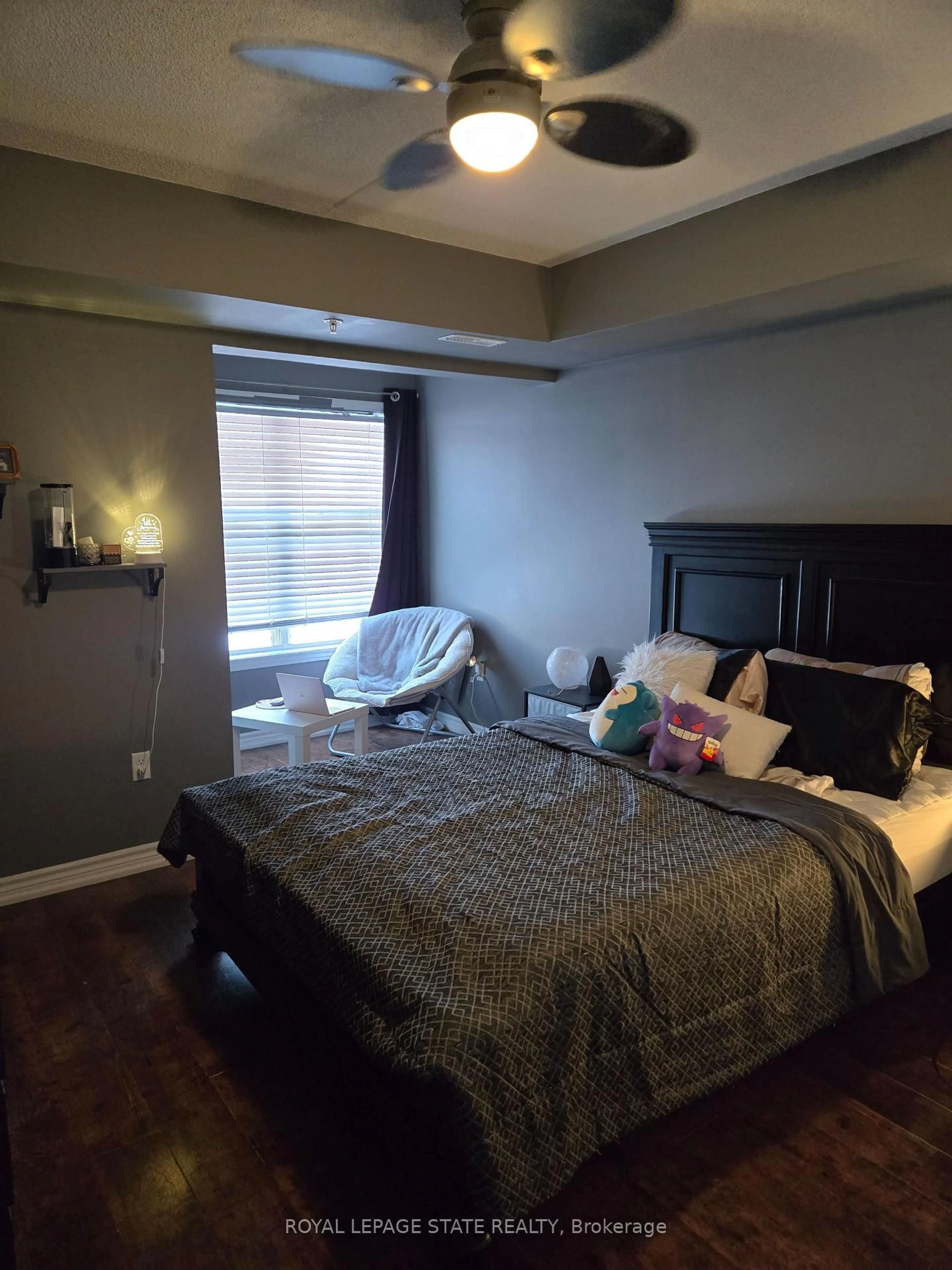 Bedroom with bed, wood/laminate floor for 1390 Main St #305, Milton Ontario L9T 7S9