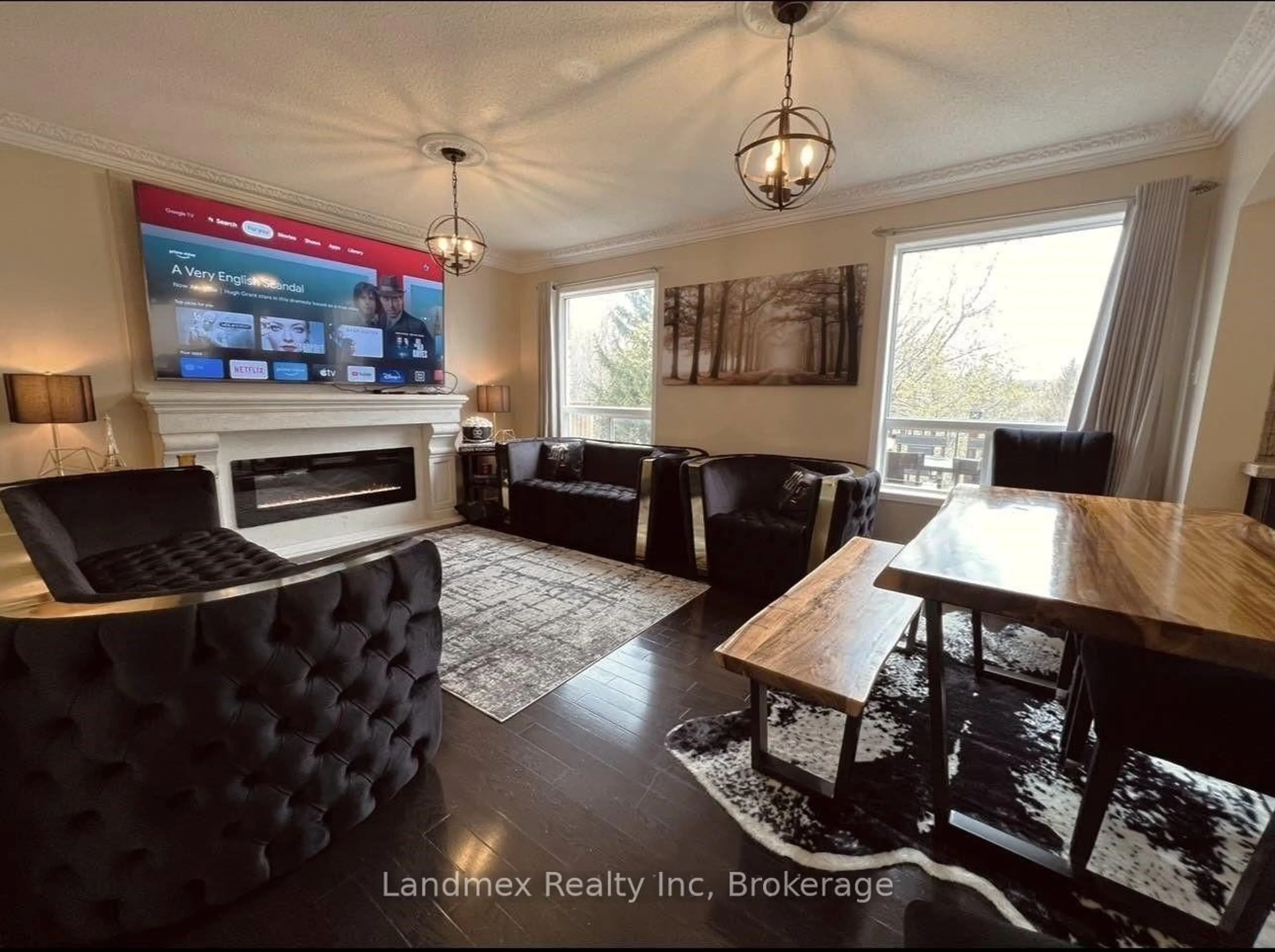 Living room with furniture, wood/laminate floor for 50 Charleswood Circ, Brampton Ontario L7A 1Z2