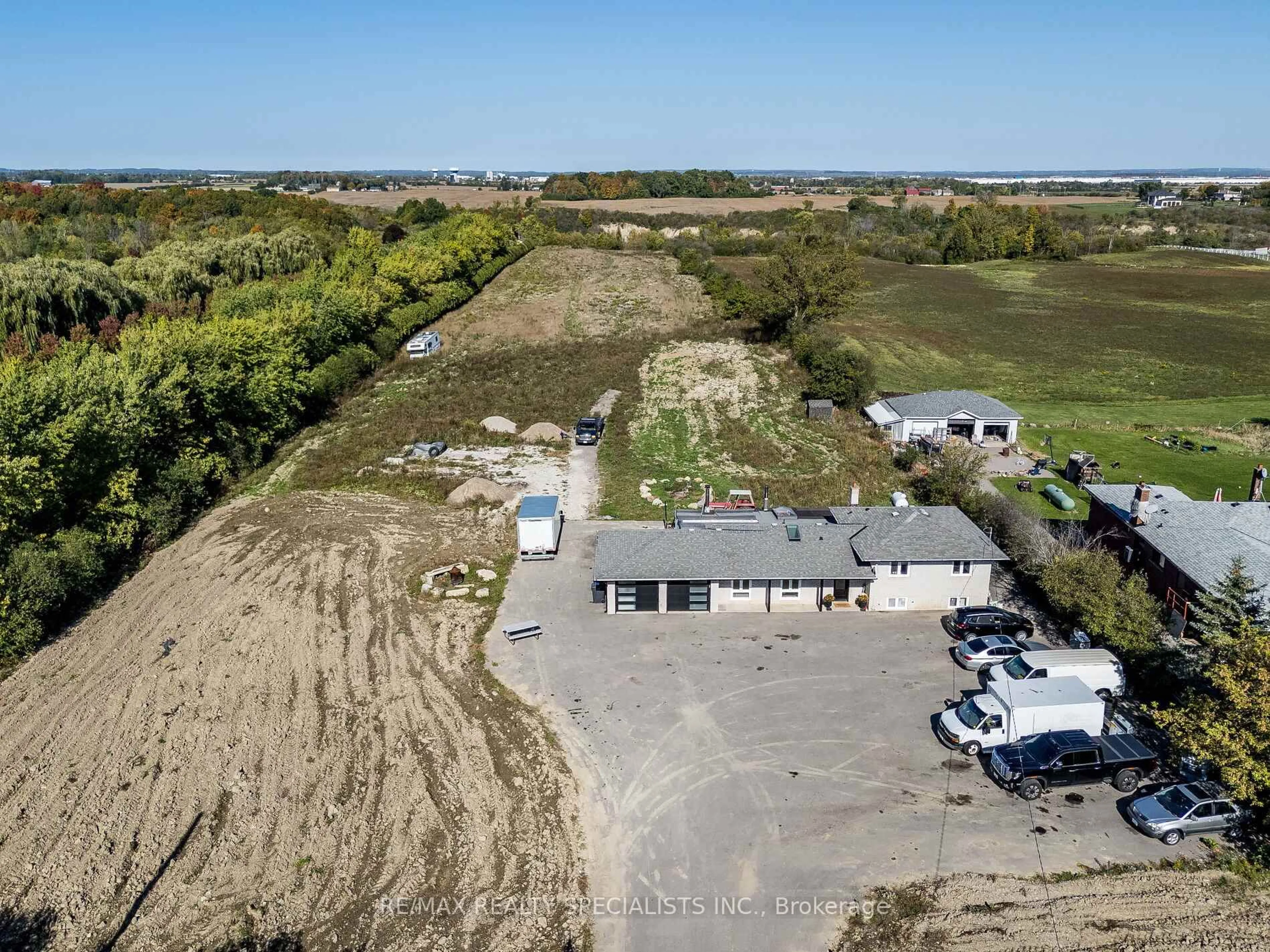 A pic from outside/outdoor area/front of a property/back of a property/a pic from drone, water/lake/river/ocean view for 13207 Centreville Creek Dr, Caledon Ontario L7C 3B8