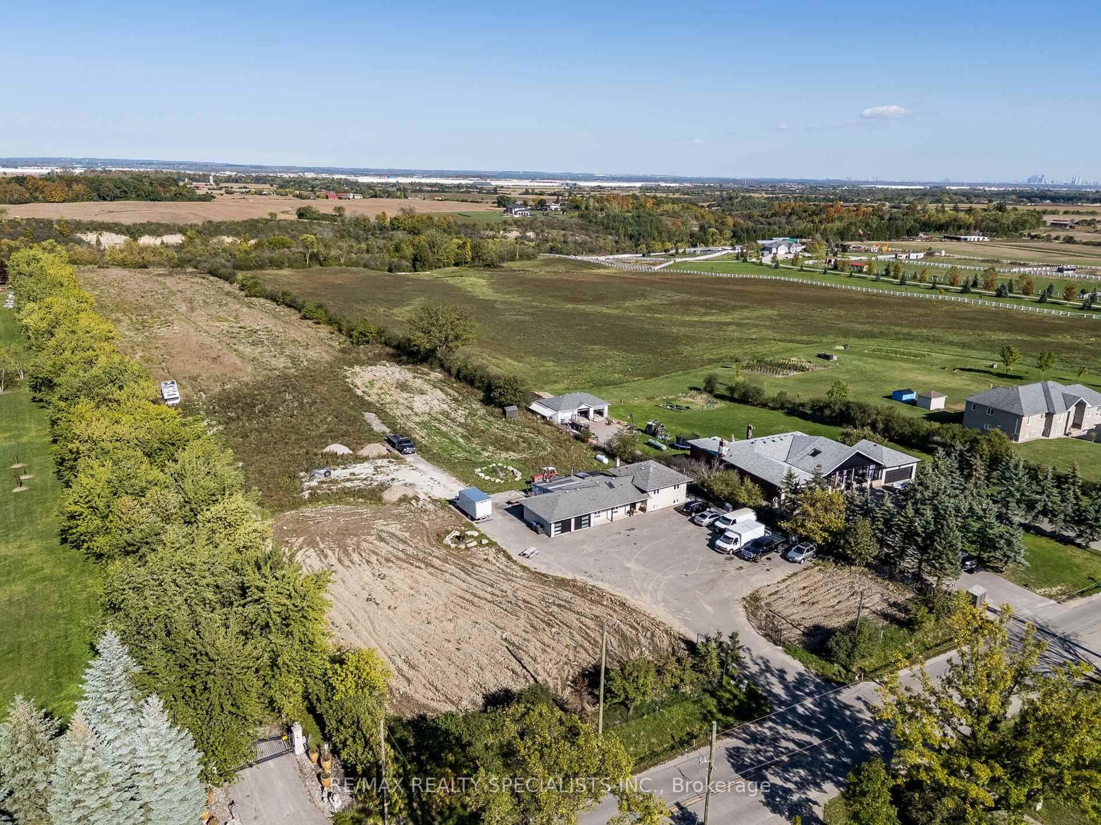 A pic from outside/outdoor area/front of a property/back of a property/a pic from drone, water/lake/river/ocean view for 13207 Centreville Creek Dr, Caledon Ontario L7C 3B8
