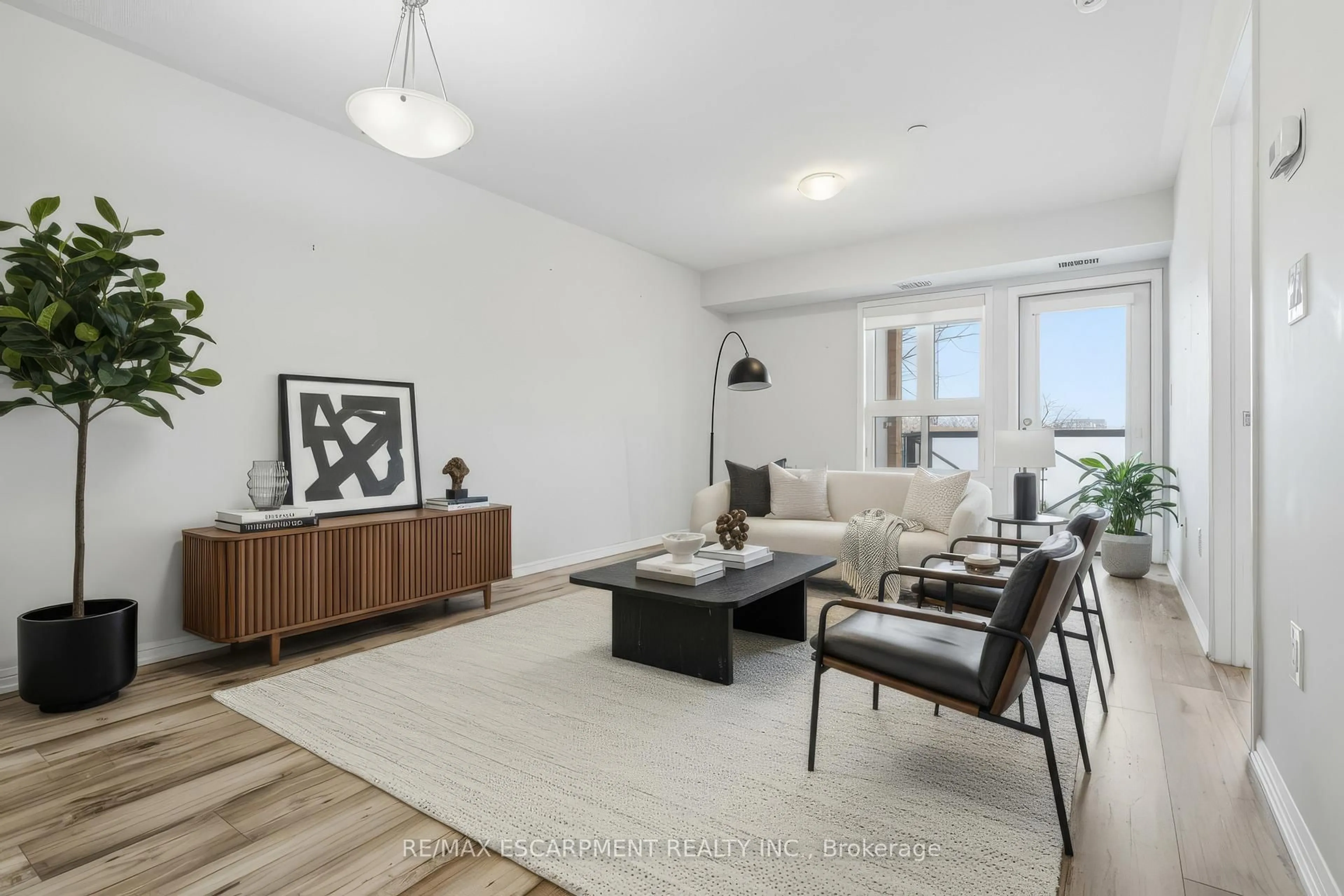 Living room with furniture, unknown for 1045 NADALIN Hts #107, Milton Ontario L9T 8R5