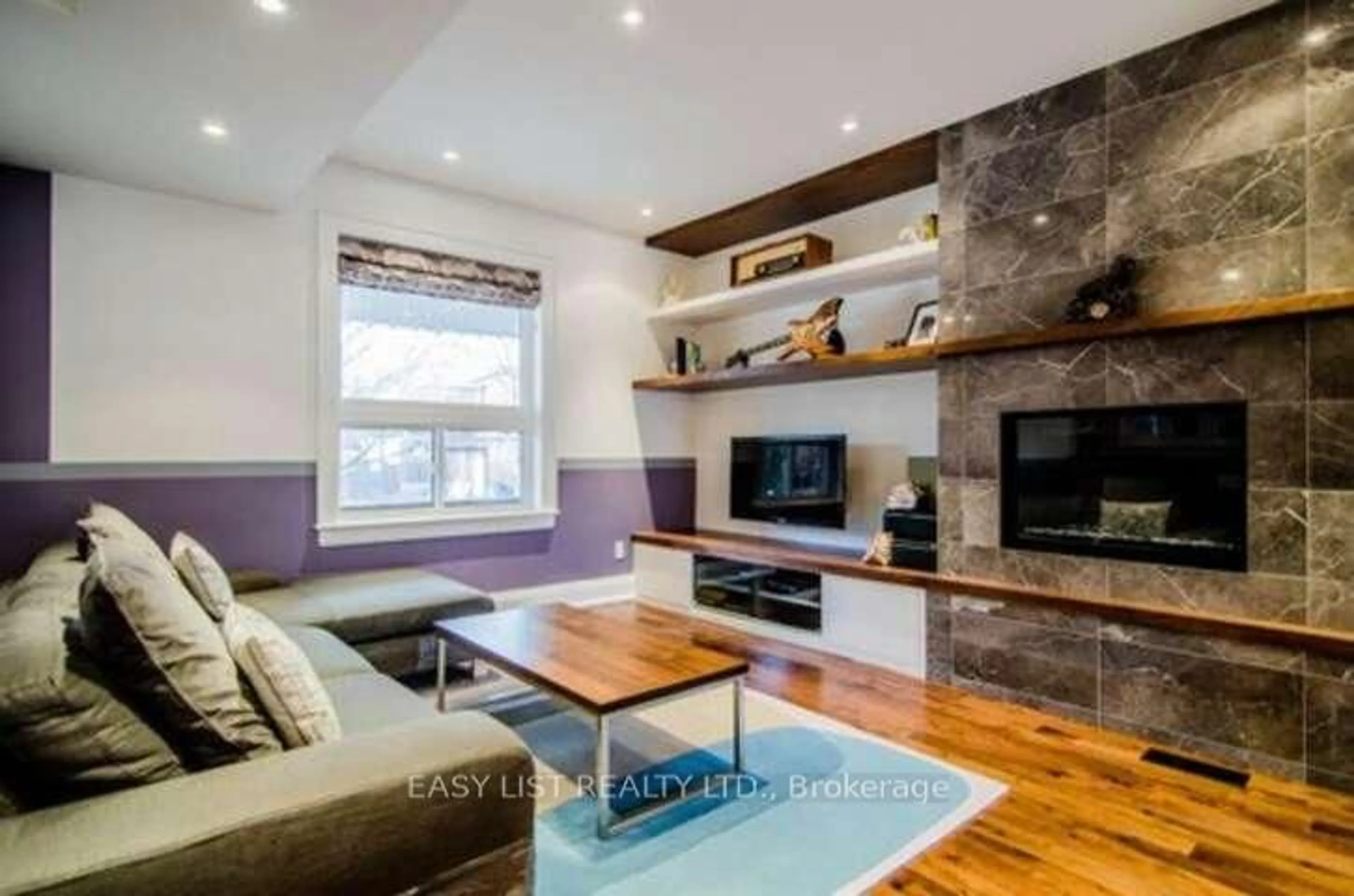 Living room with furniture, wood/laminate floor for 76 Dunn Ave, Toronto Ontario M6K 2R6