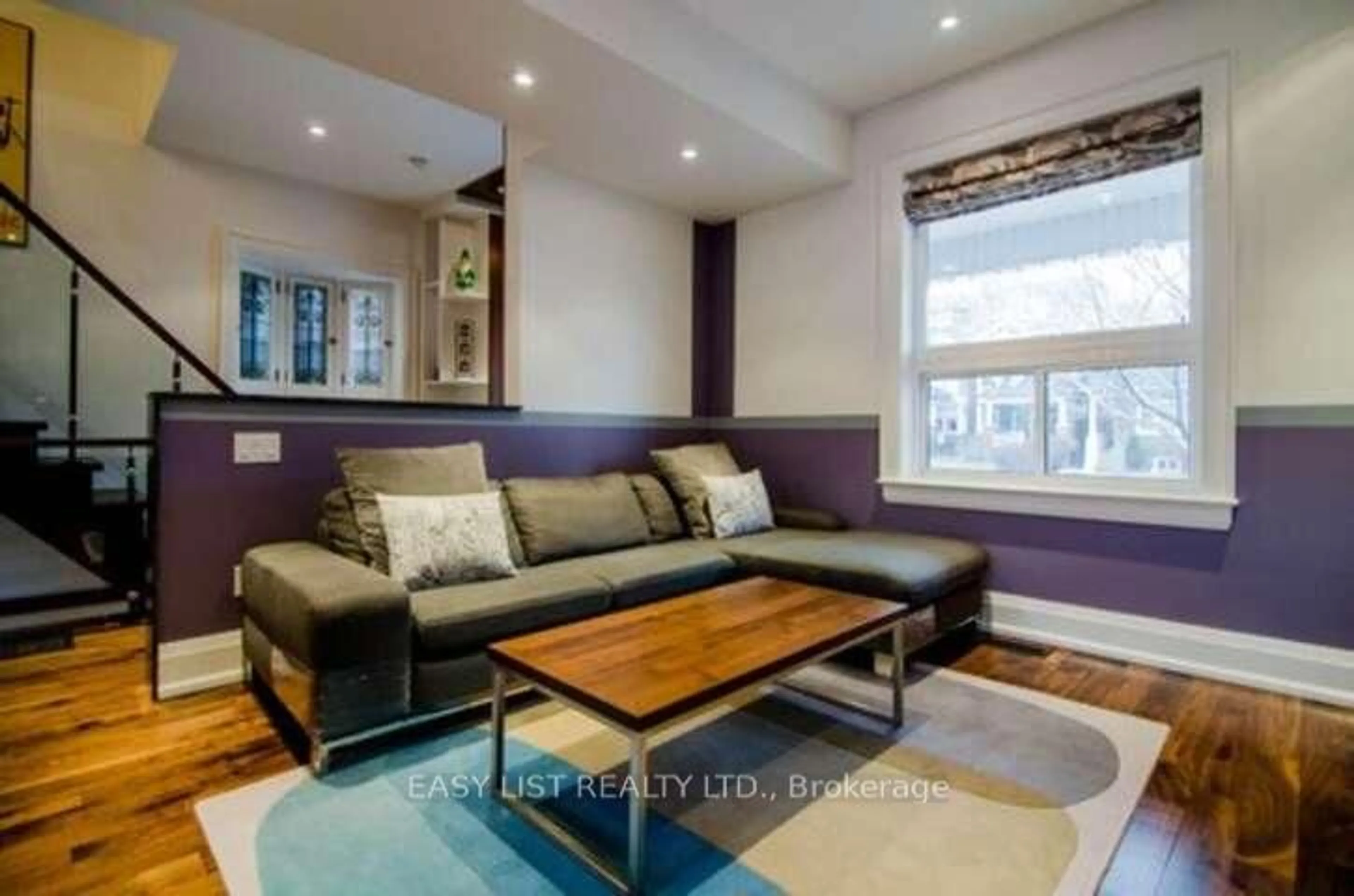 Living room with furniture, wood/laminate floor for 76 Dunn Ave, Toronto Ontario M6K 2R6