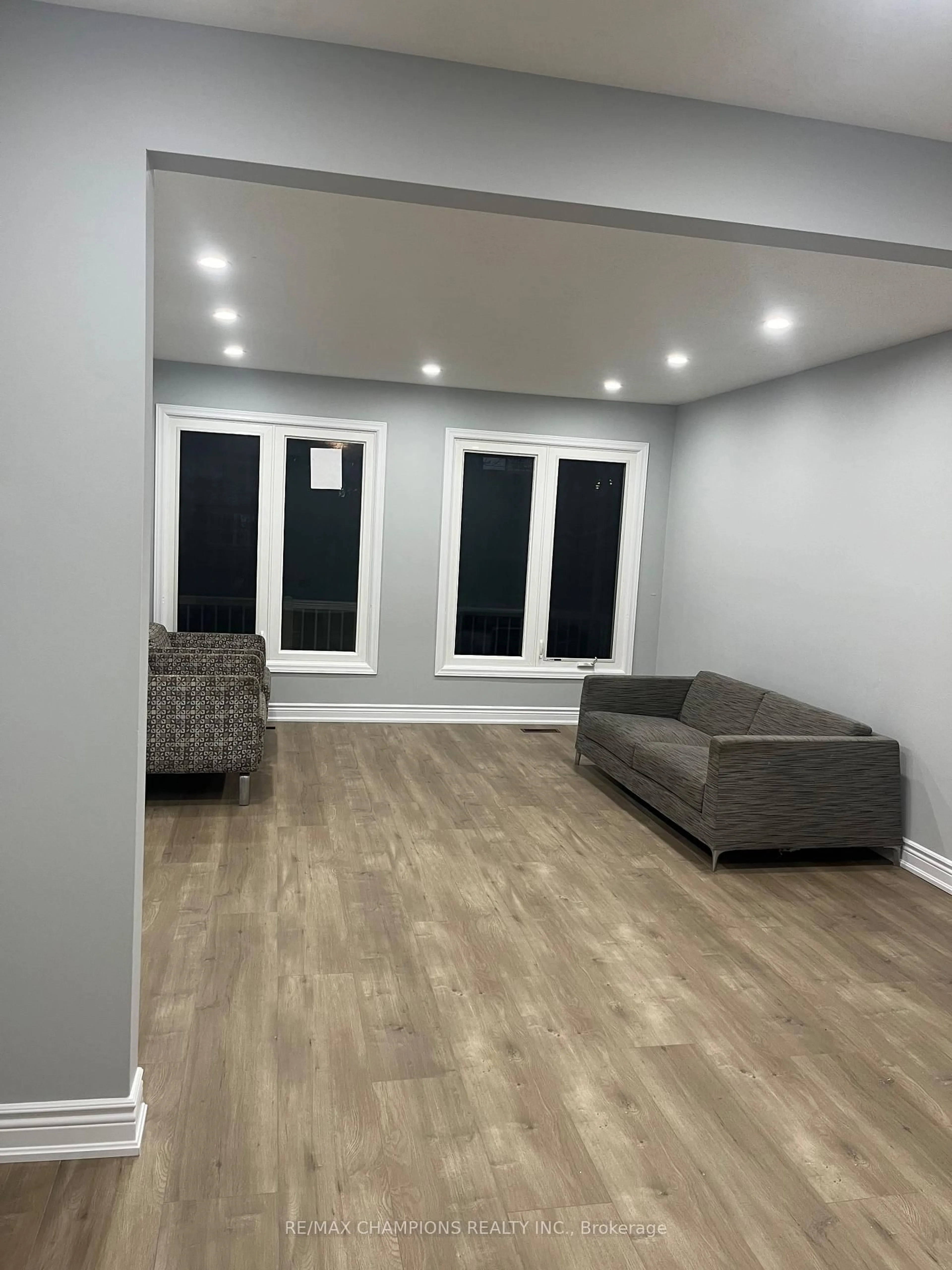 Living room with furniture, wood/laminate floor for 249 Centre St, Brampton Ontario L6V 2R3
