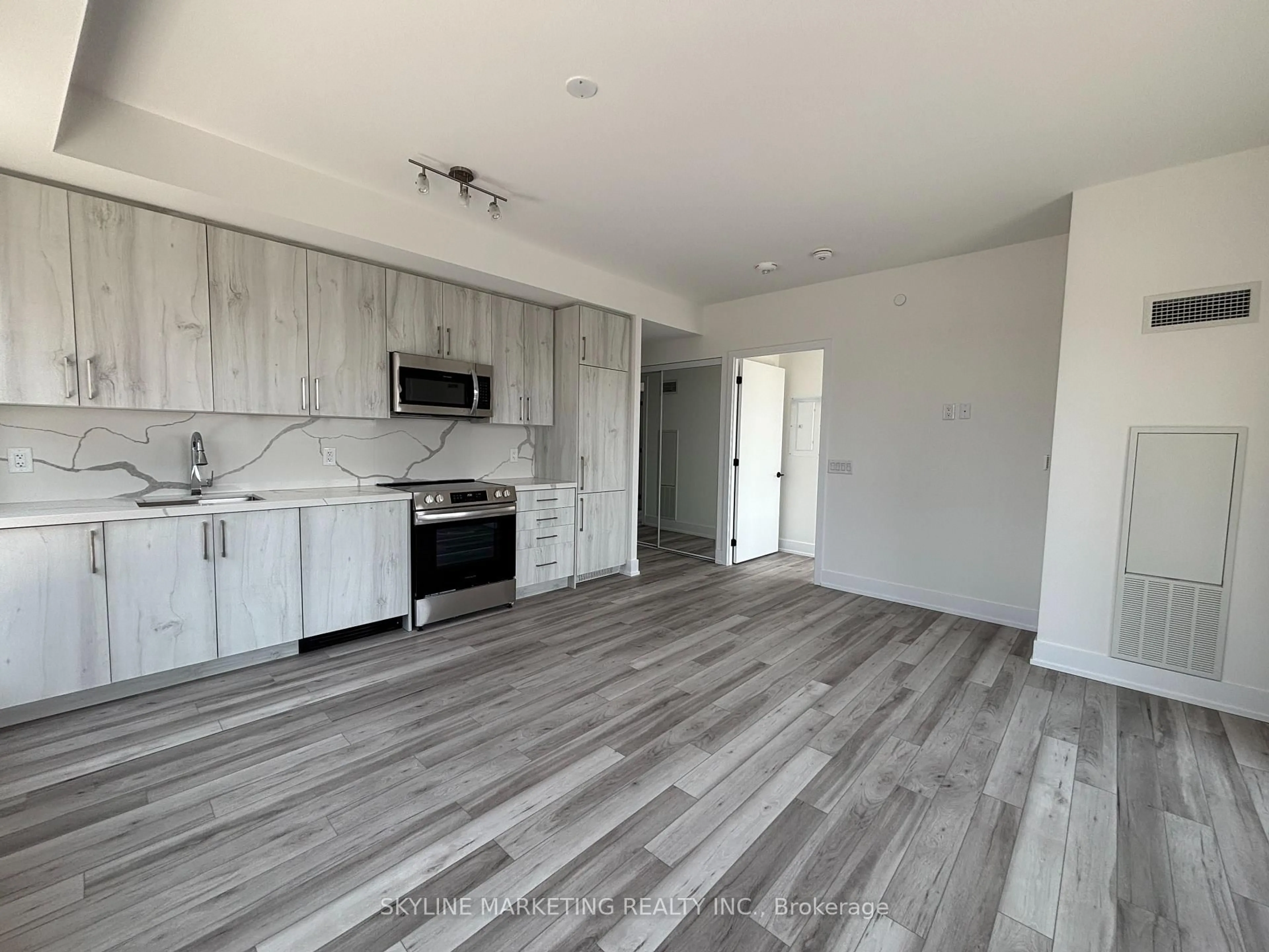 Open concept kitchen, wood/laminate floor for 2450 Old Bronte Rd #345, Oakville Ontario L6M 5P6