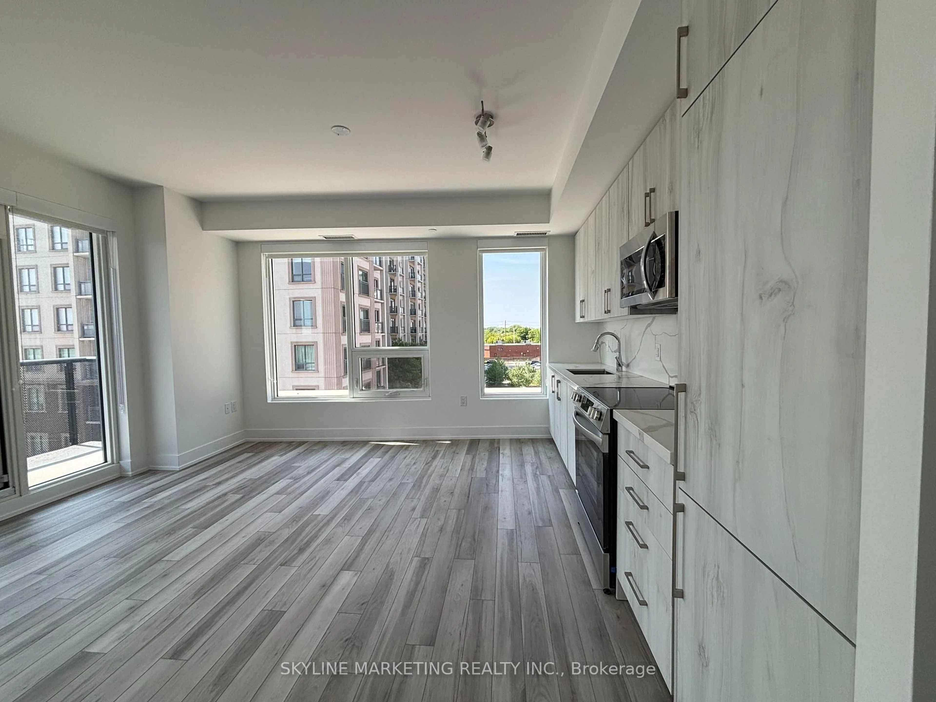 Open concept kitchen, wood/laminate floor for 2450 Old Bronte Rd #345, Oakville Ontario L6M 5P6