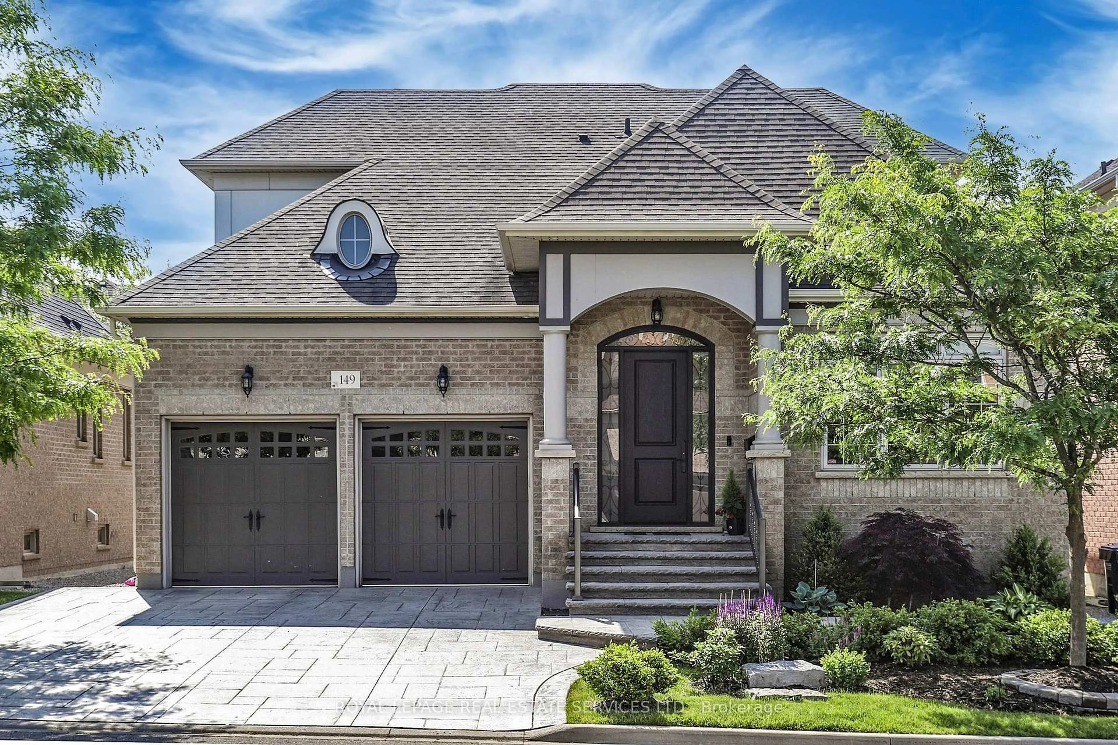 Home with brick exterior material, street for 149 Coastline Dr, Brampton Ontario L6Y 0S3