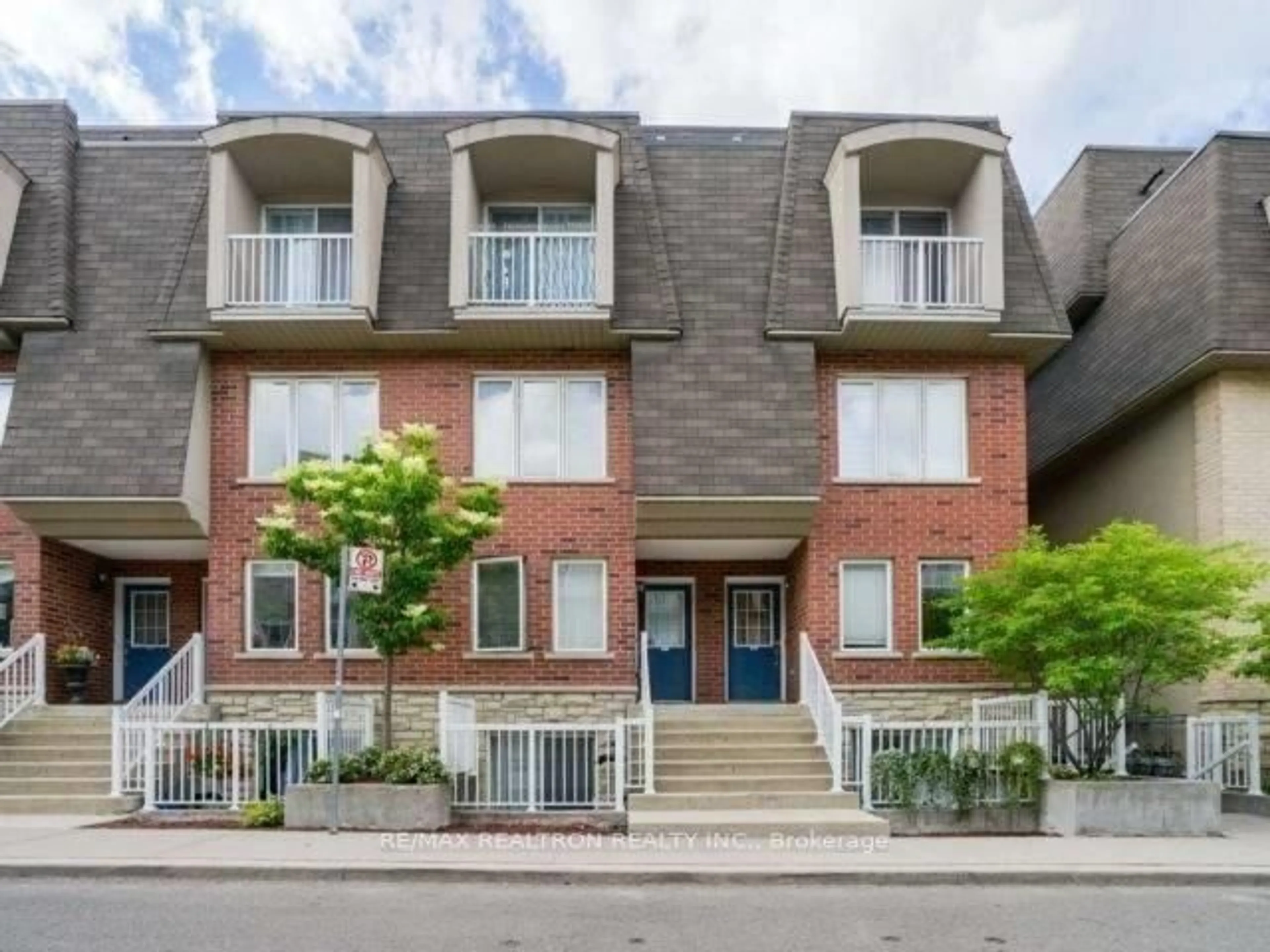 Home with brick exterior material, street for 65 Turntable Cres #90, Toronto Ontario M6H 4K8