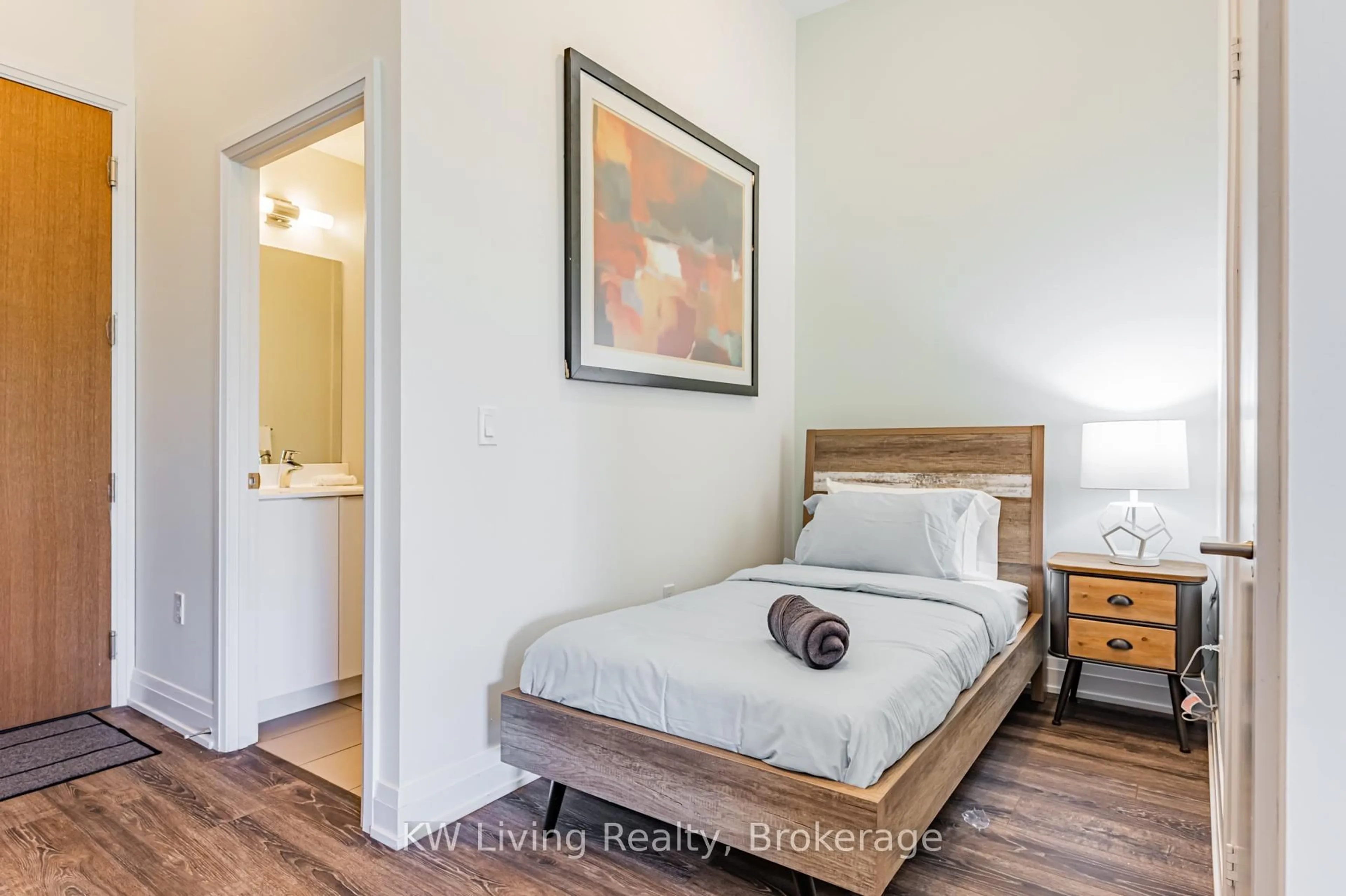 Bedroom with bed, wood/laminate floor for 20 Shore Breeze Dr #M09, Toronto Ontario M8V 1A1
