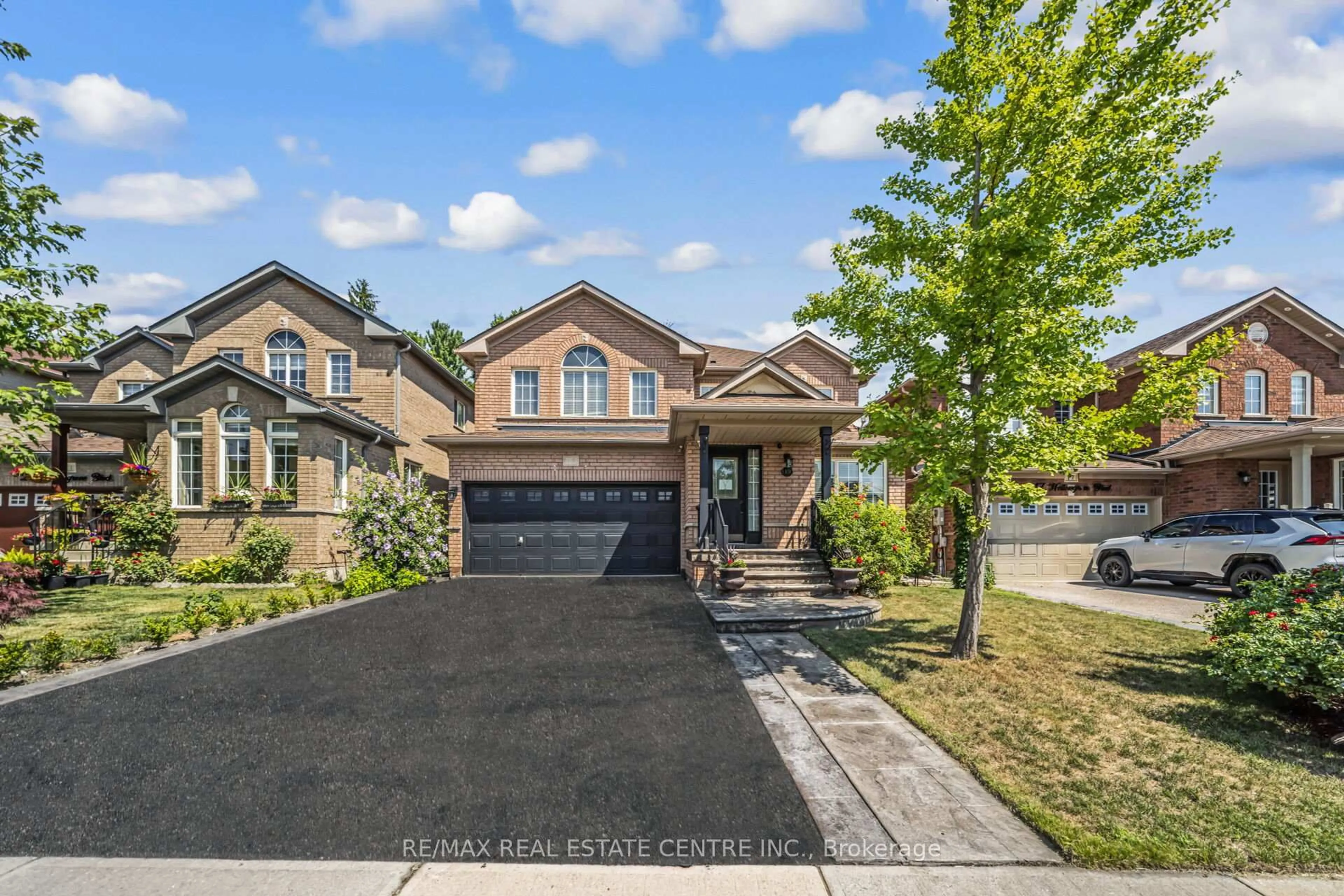 Home with brick exterior material, street for 19 Hollowgrove Blvd, Brampton Ontario L6P 1B1