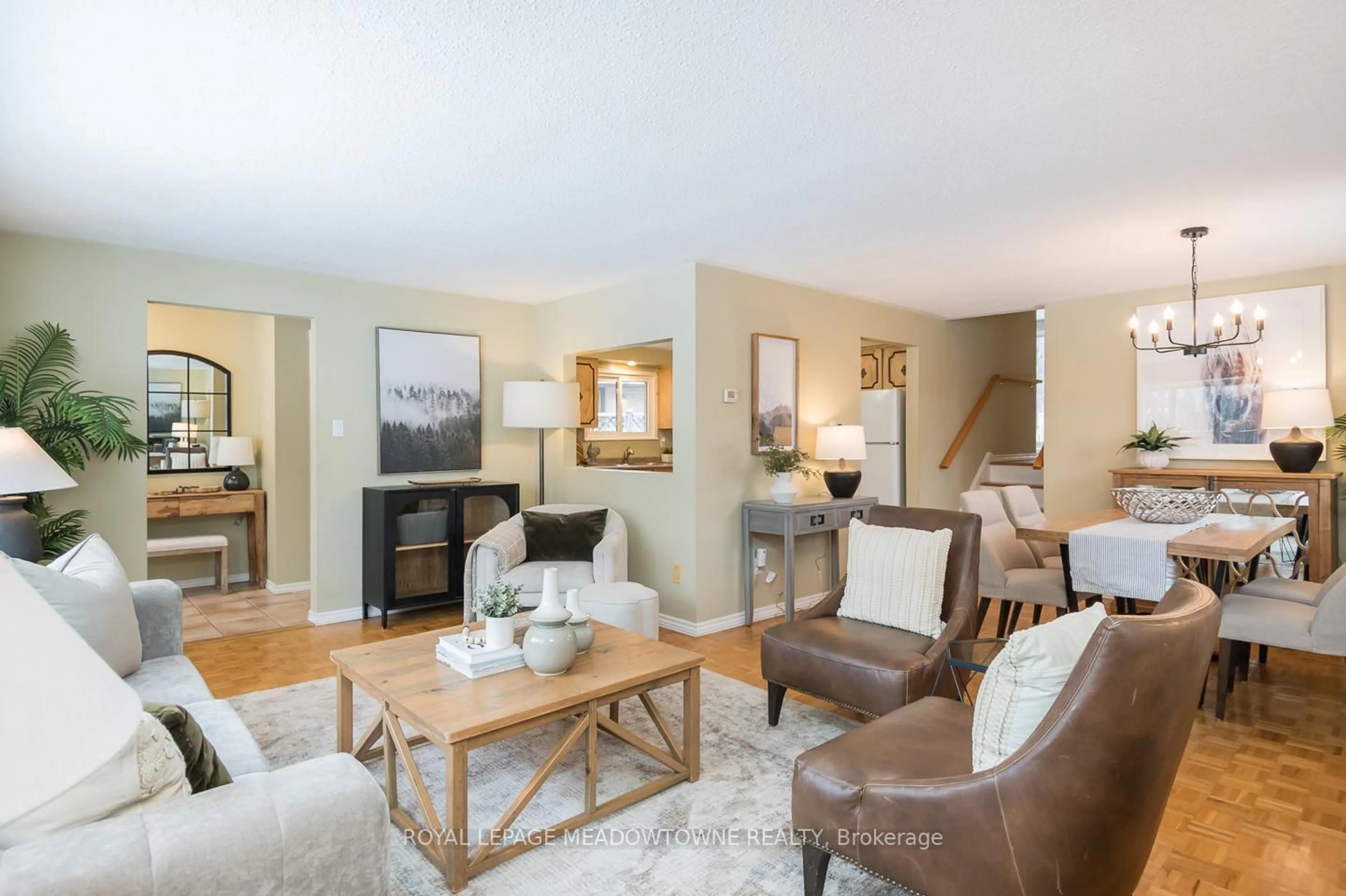 Living room with furniture, wood/laminate floor for 65 Lorne Scots Dr, Milton Ontario L9T 2Z2