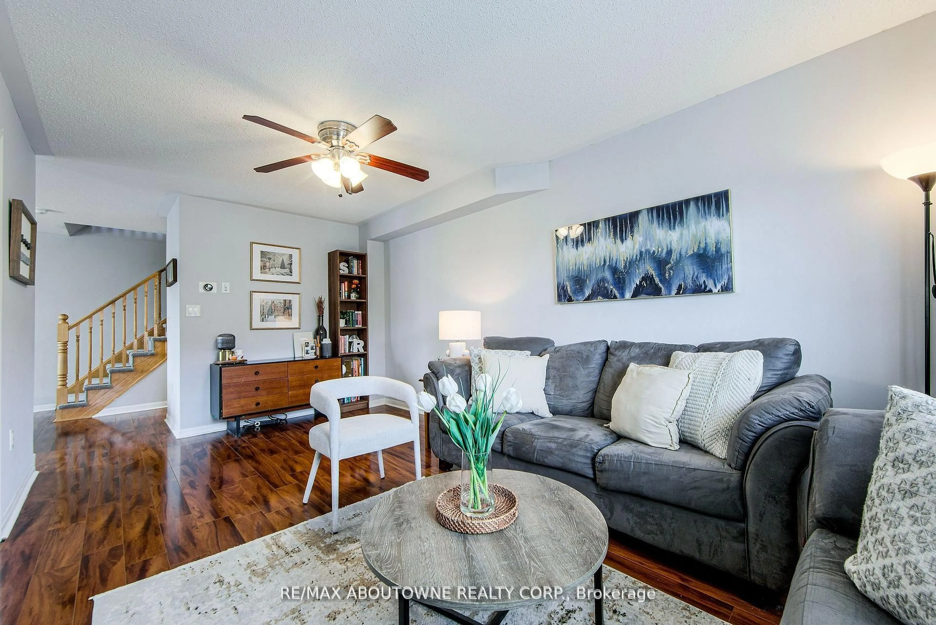 Living room with furniture, wood/laminate floor for 911 Deverell Pl, Milton Ontario L9T 0M2