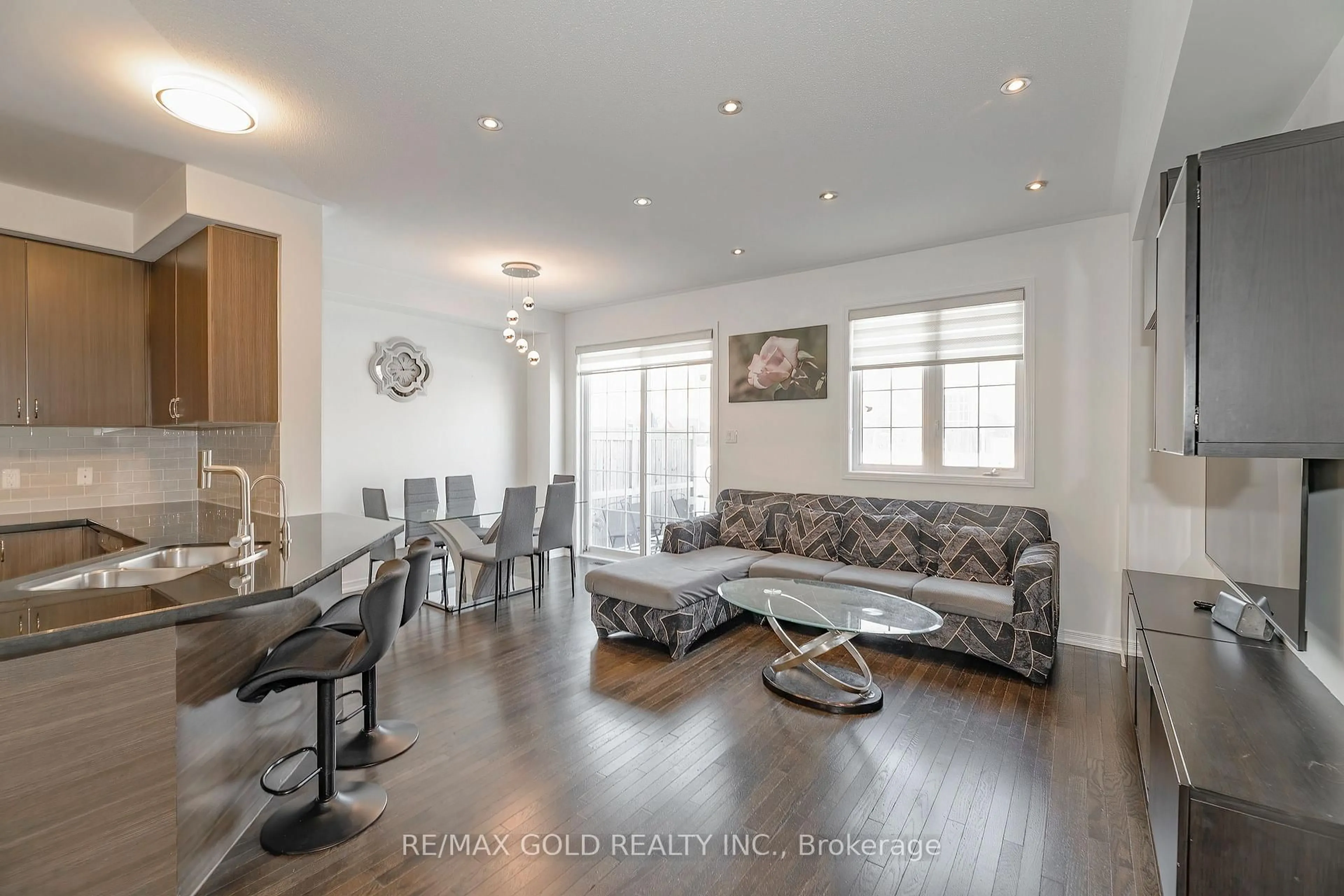 Living room with furniture, wood/laminate floor for 84 Honeyview Tr, Brampton Ontario L6P 4A4