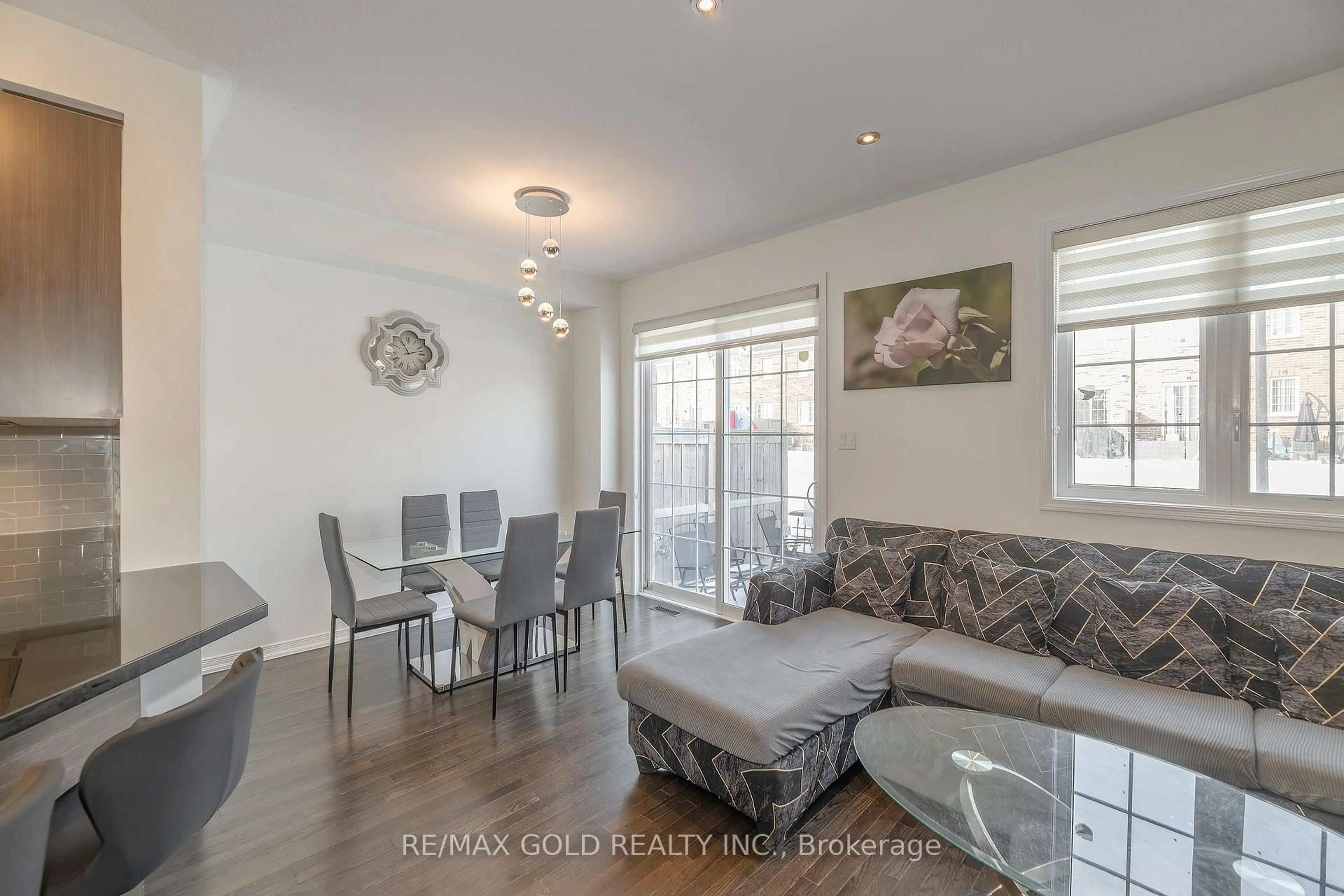 Living room with furniture, wood/laminate floor for 84 Honeyview Tr, Brampton Ontario L6P 4A4