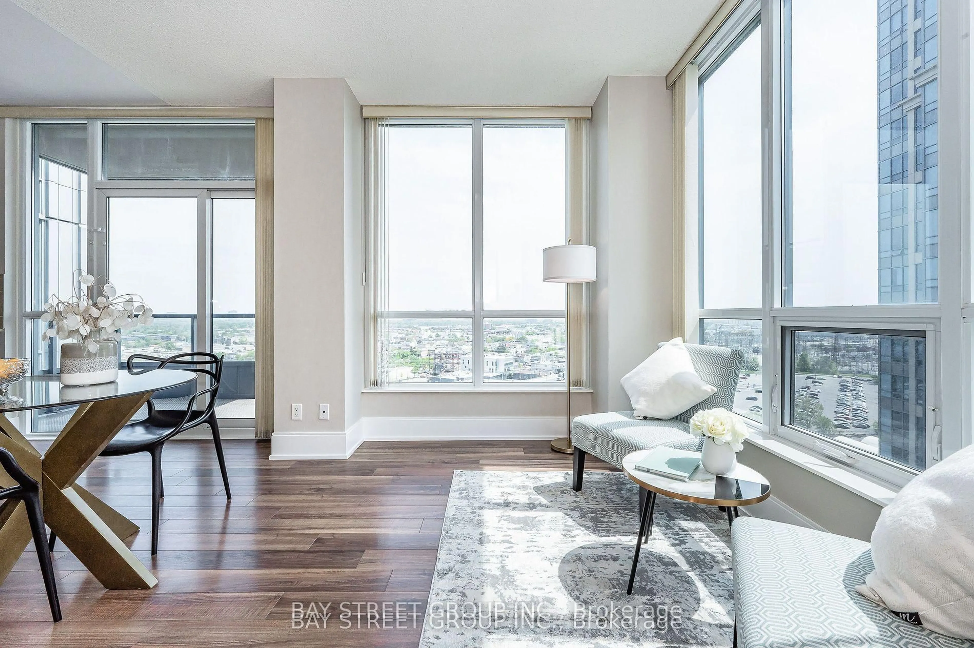 Living room with furniture, wood/laminate floor for 15 Viking Lane #1202, Toronto Ontario M9B 0A4