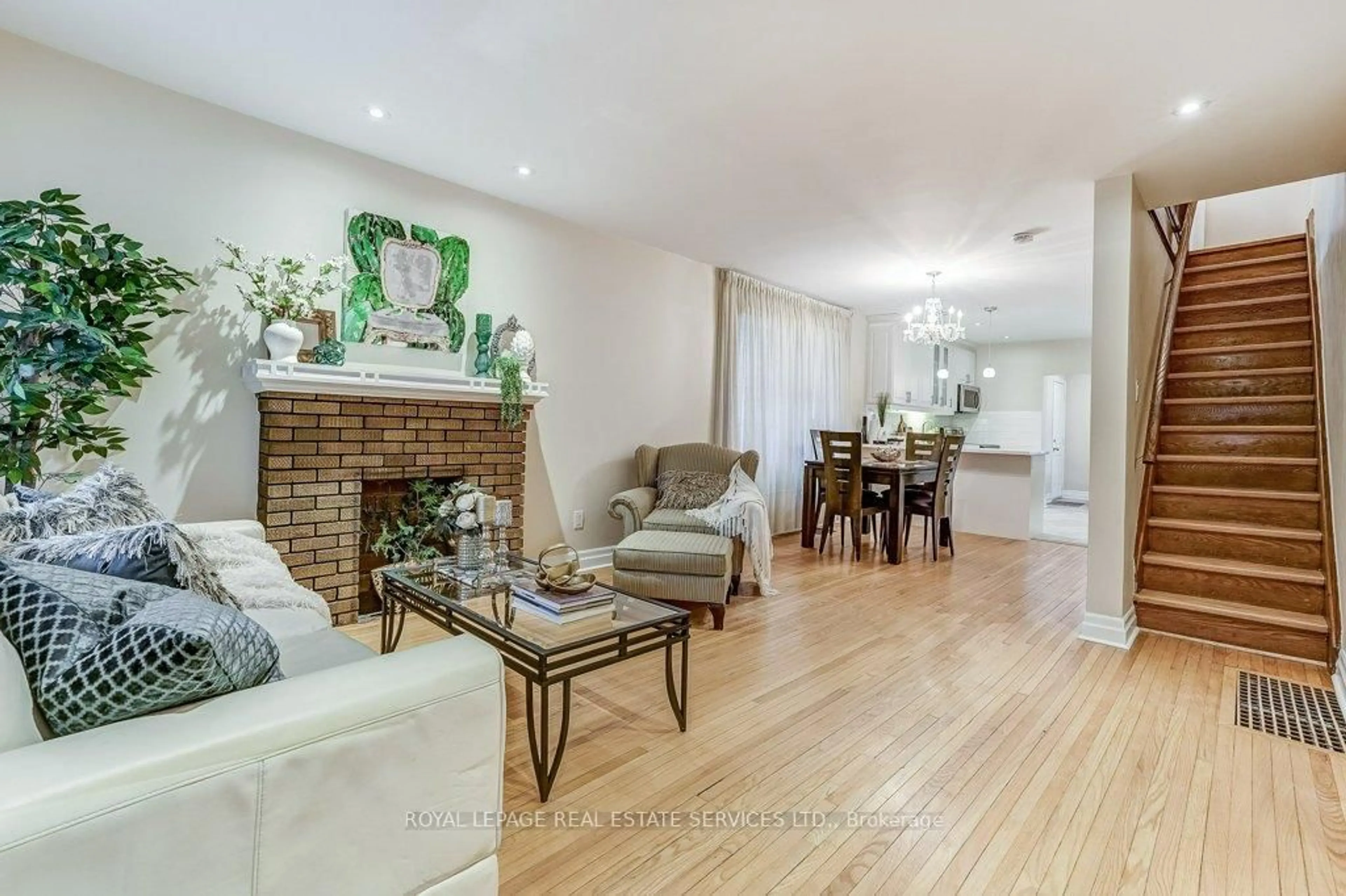 Living room with furniture, wood/laminate floor for 612 Beresford Ave, Toronto Ontario M6S 3C3