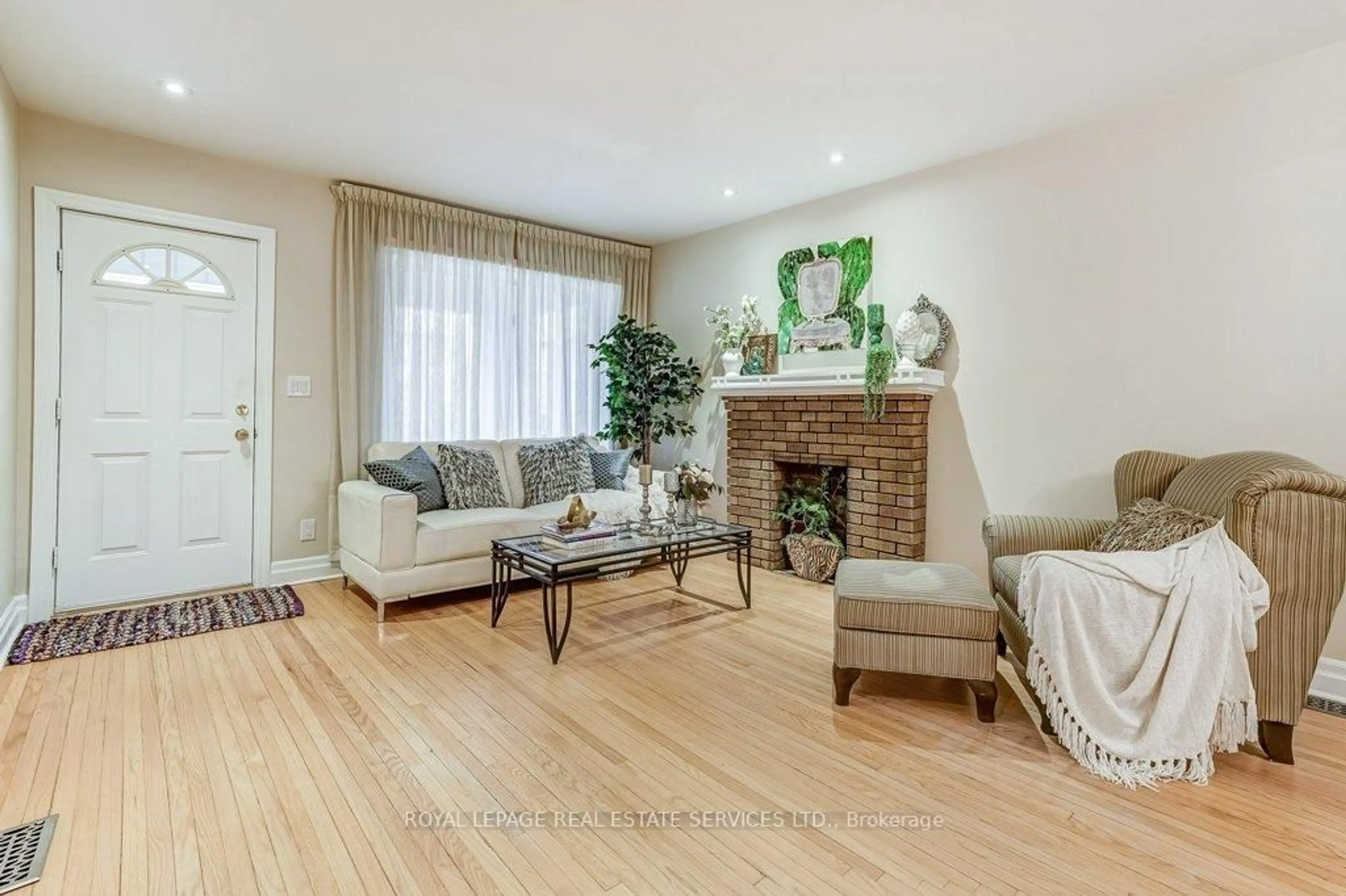 Living room with furniture, wood/laminate floor for 612 Beresford Ave, Toronto Ontario M6S 3C3