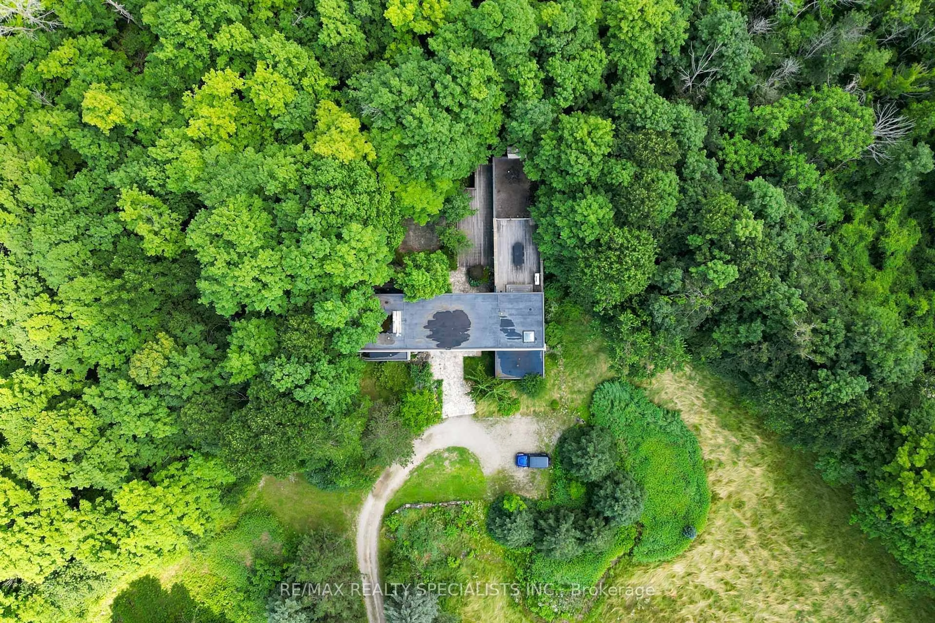 A pic from outside/outdoor area/front of a property/back of a property/a pic from drone, forest/trees view for 15139 Rockside Rd, Caledon Ontario L7C 1V4