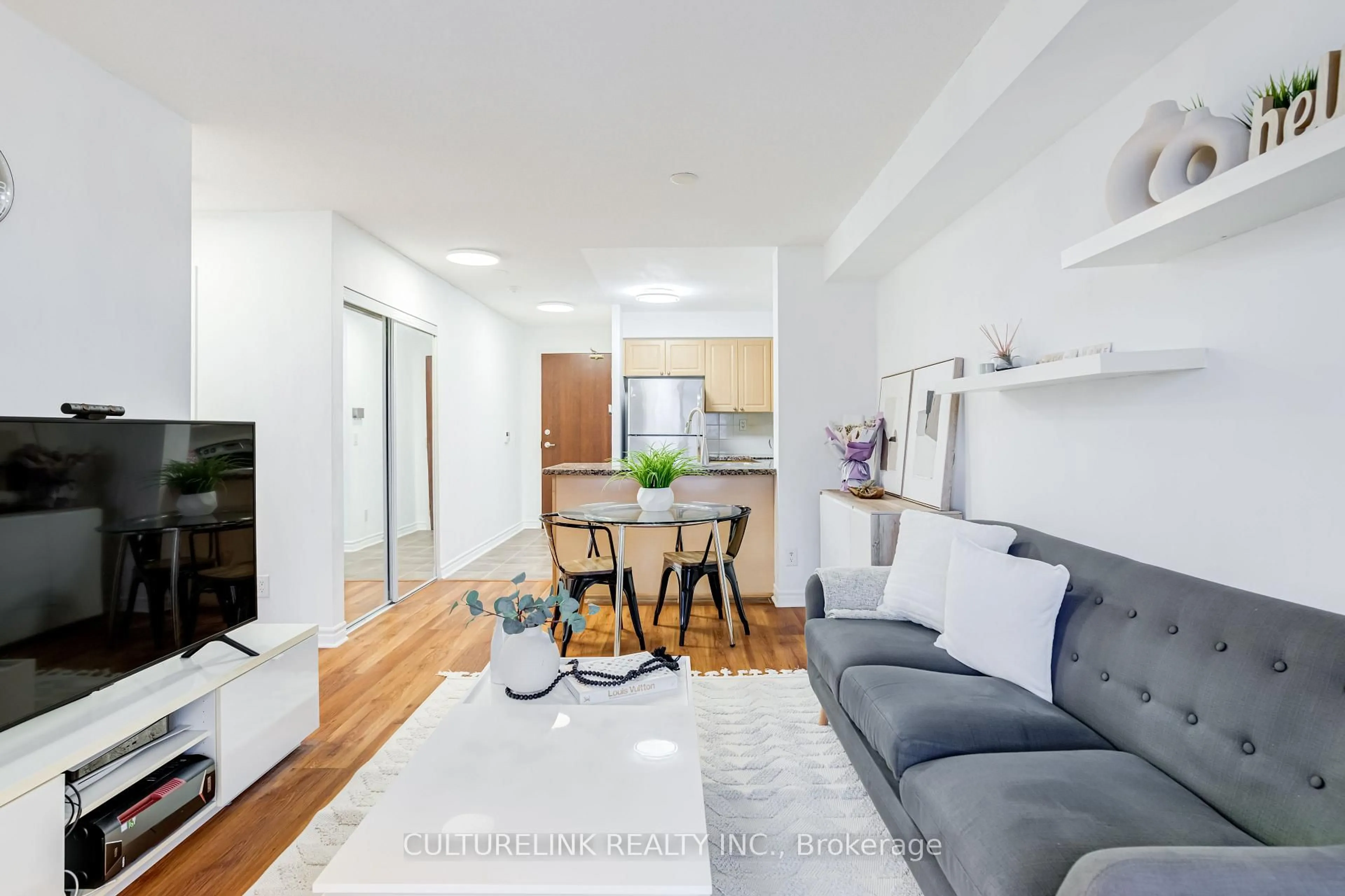 Living room with furniture, wood/laminate floor for 5 Michael Power Pl #2209, Toronto Ontario M9A 0A3