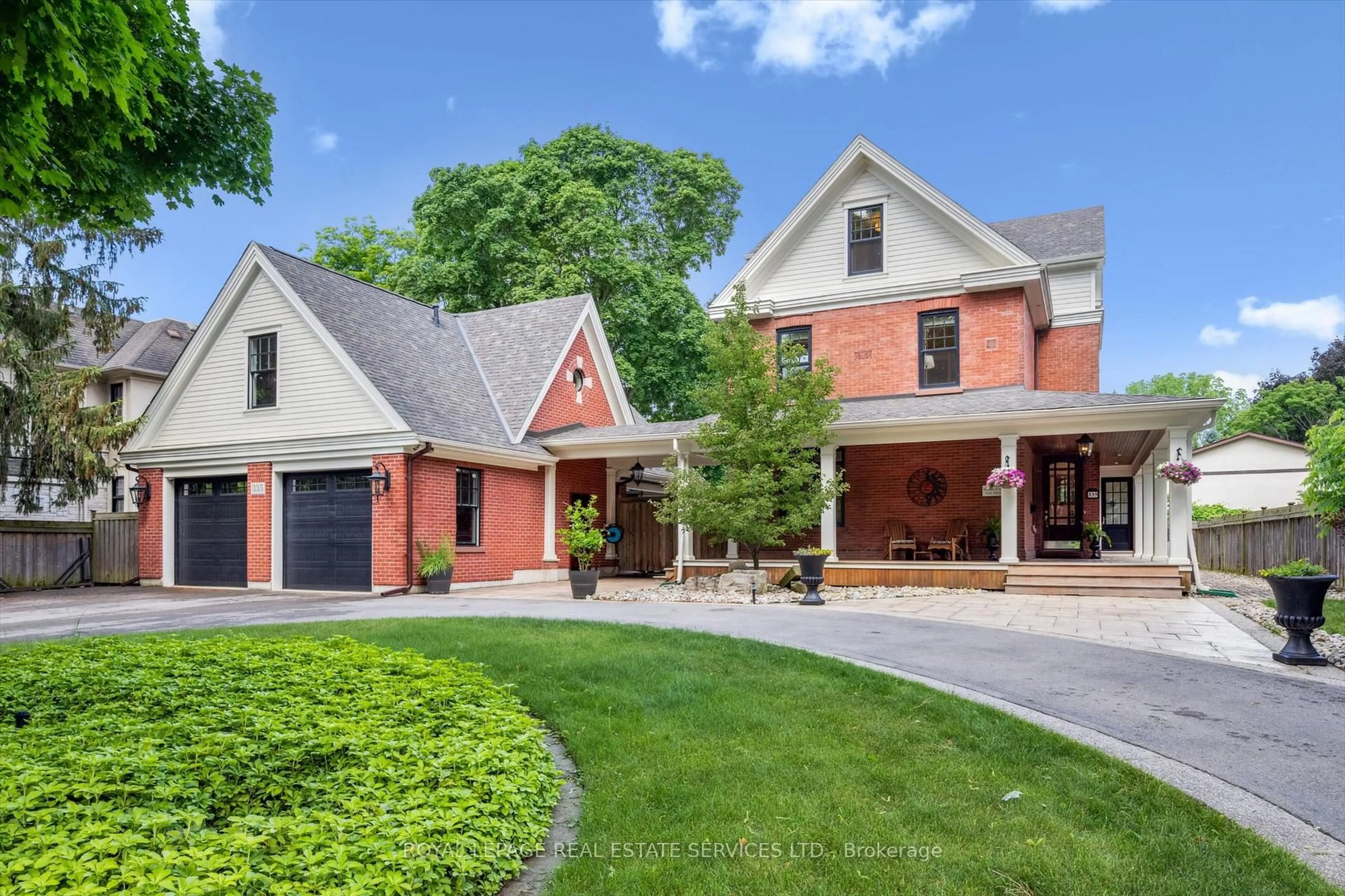 Home with brick exterior material, street for 335 Lakeshore Rd, Oakville Ontario L6K 1G3