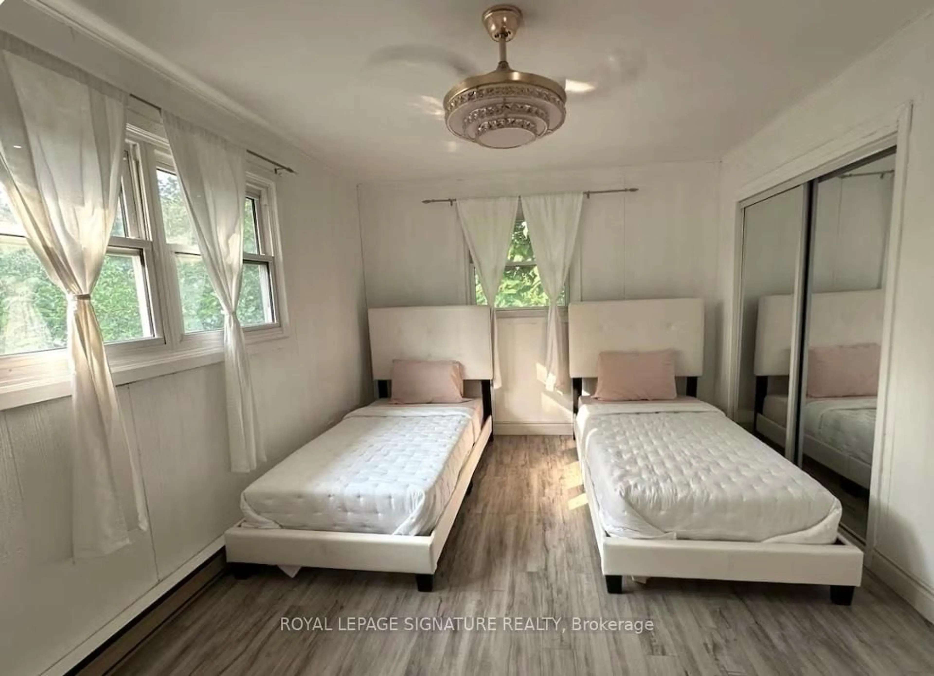 Bedroom with bed, wood/laminate floor for 1119 Rebecca St, Oakville Ontario L6L 1Y6