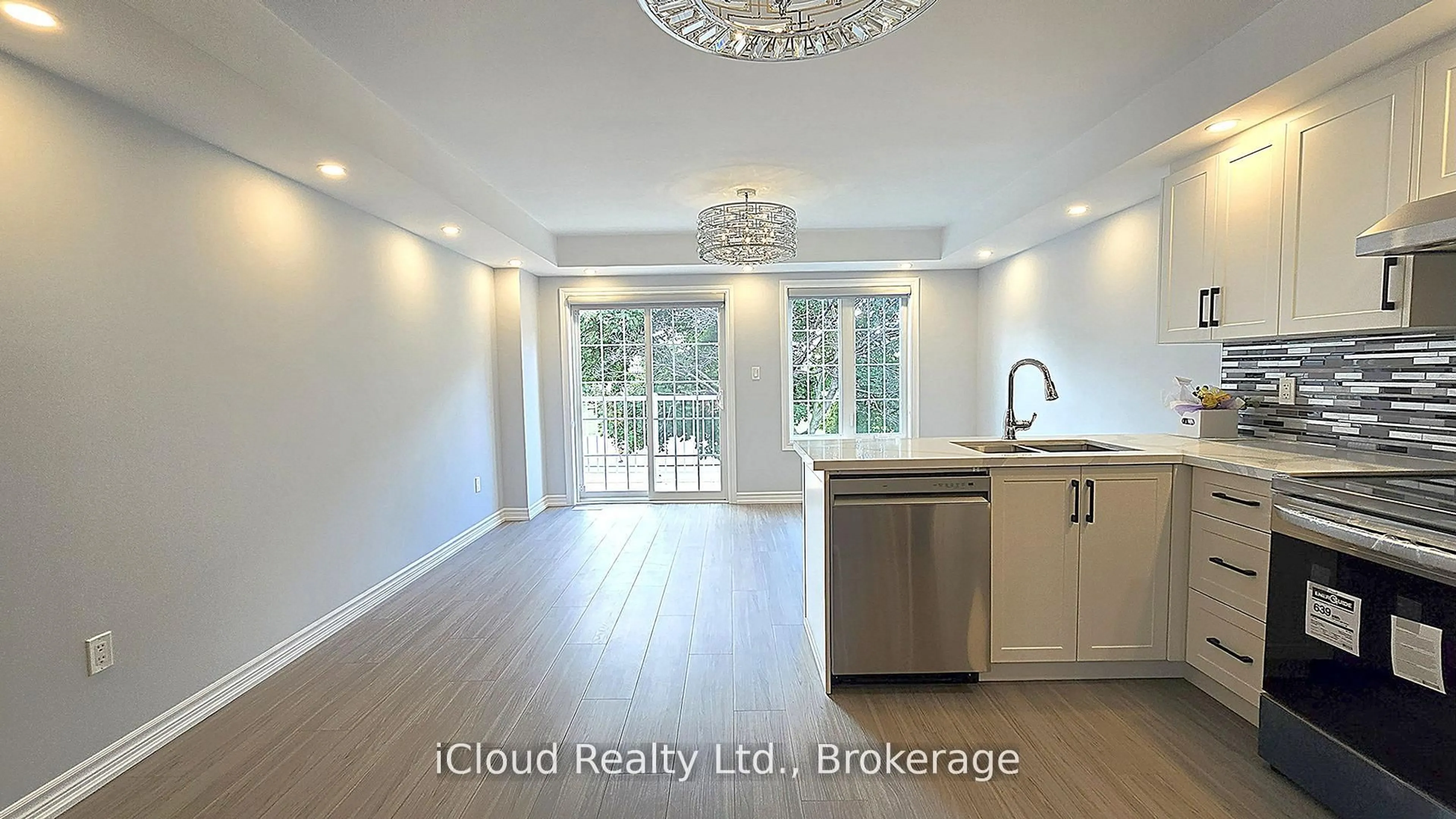 Open concept kitchen, wood/laminate floor for 43 Mantello Dr, Toronto Ontario M3J 0H6