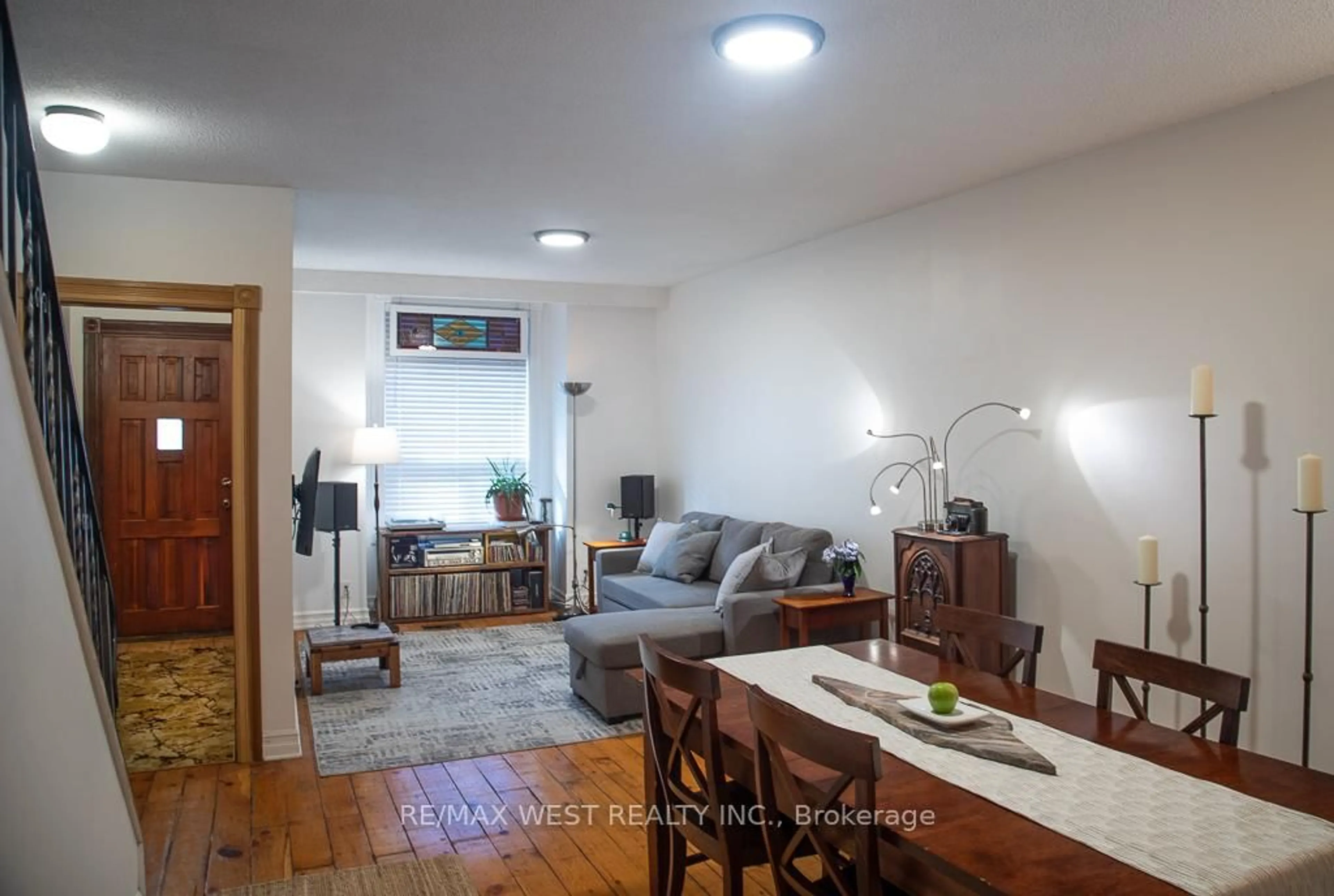 Living room with furniture, wood/laminate floor for 509 Perth Ave, Toronto Ontario M6N 2W6