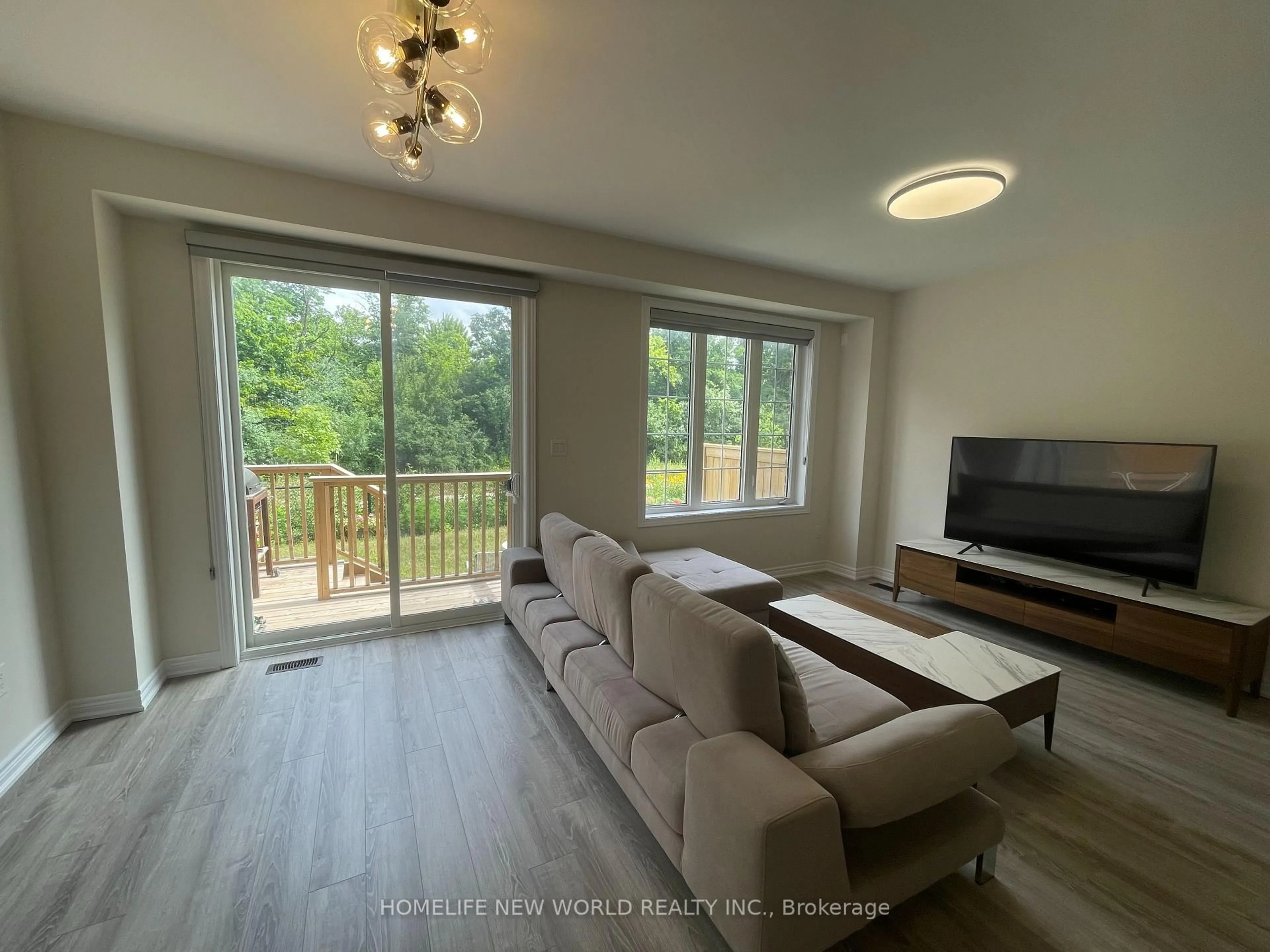 Living room with furniture, wood/laminate floor for 3335 Mockingbird Common, Oakville Ontario L6H 0X1