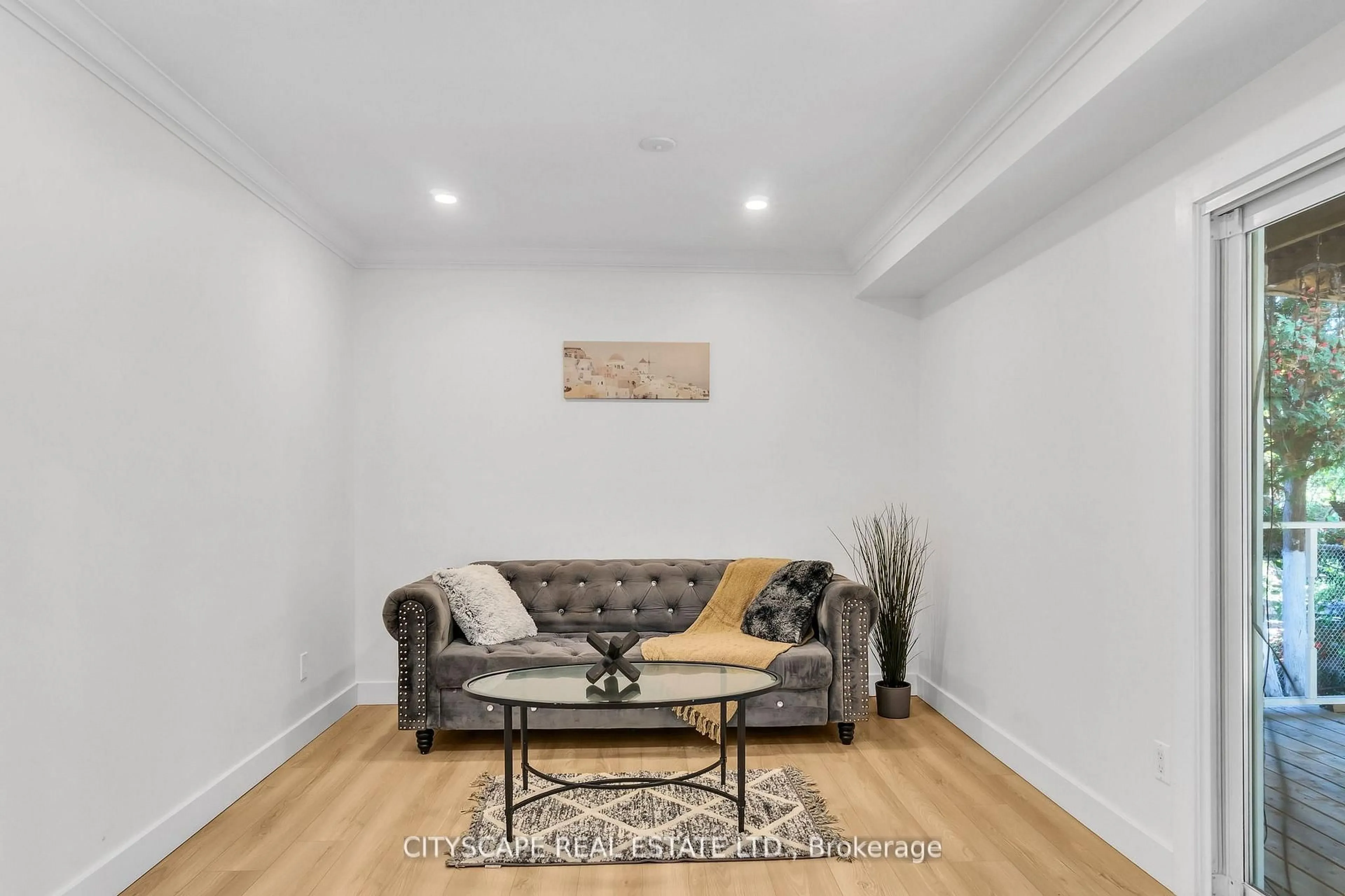 Living room with furniture, wood/laminate floor for 3 Geneva Cres, Brampton Ontario L6S 1K7