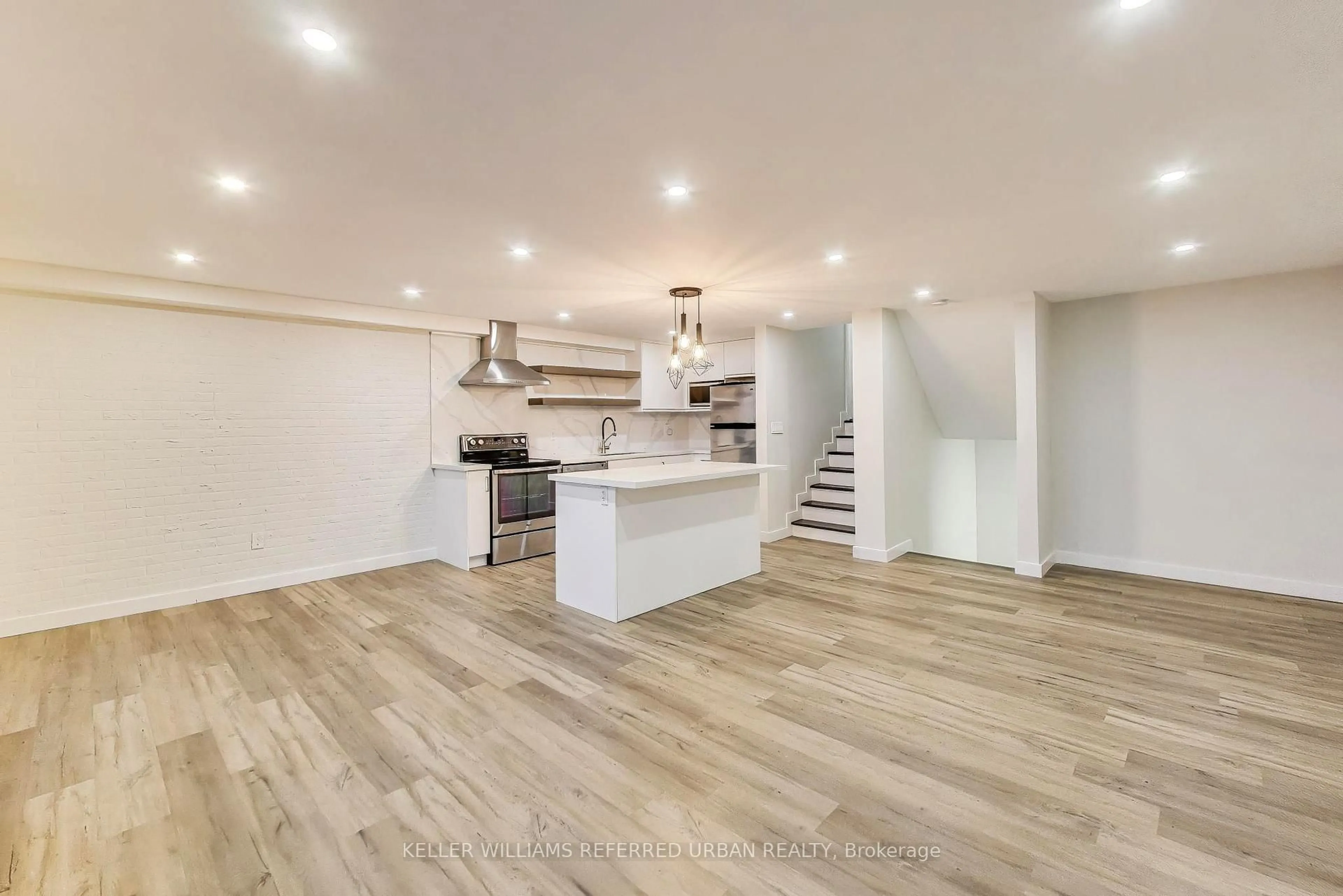 Open concept kitchen, wood/laminate floor for 11 Wincott Dr #1215, Toronto Ontario M9R 2R9