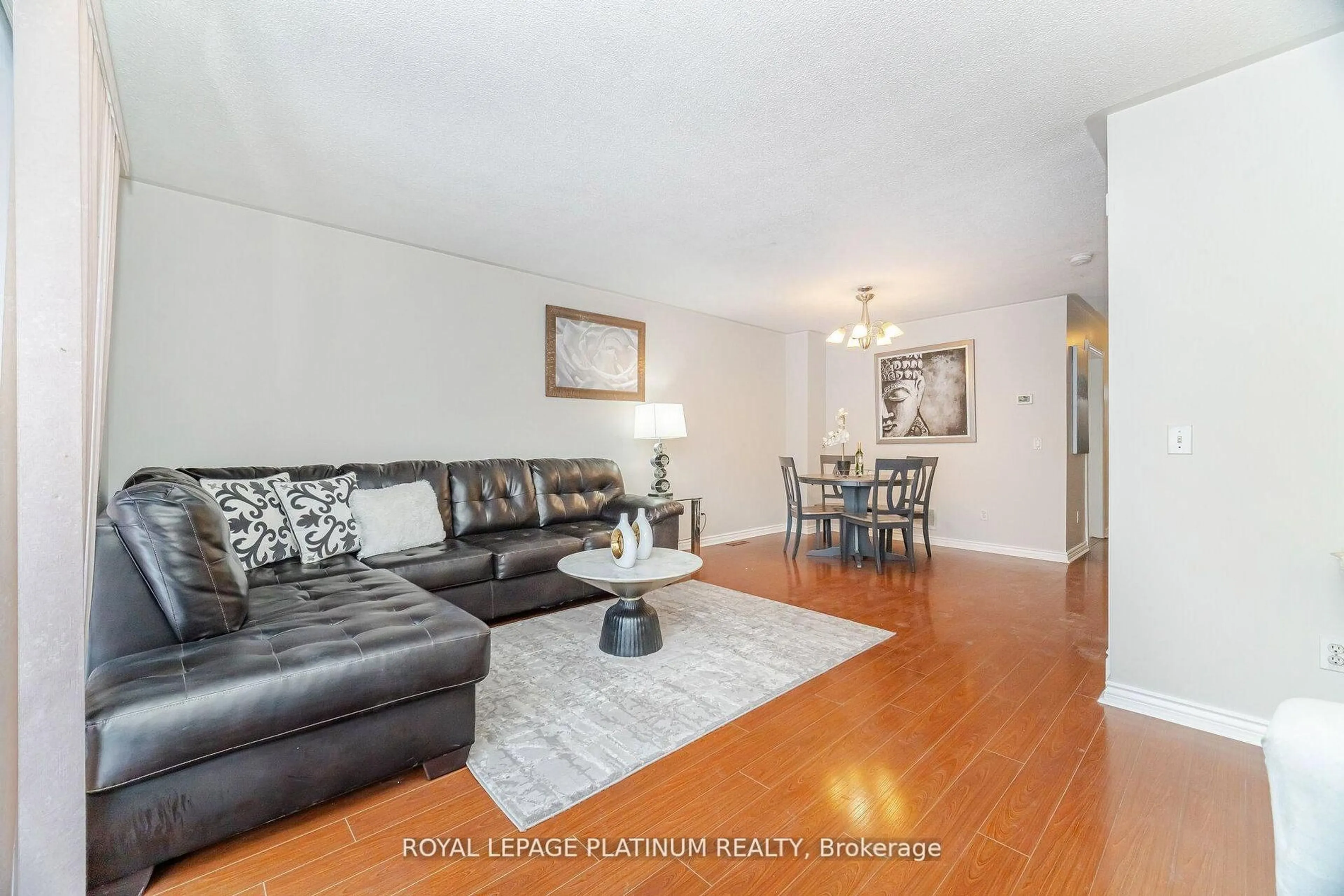 Living room with furniture, wood/laminate floor for 51 Softneedle Ave, Brampton Ontario L6R 1K7