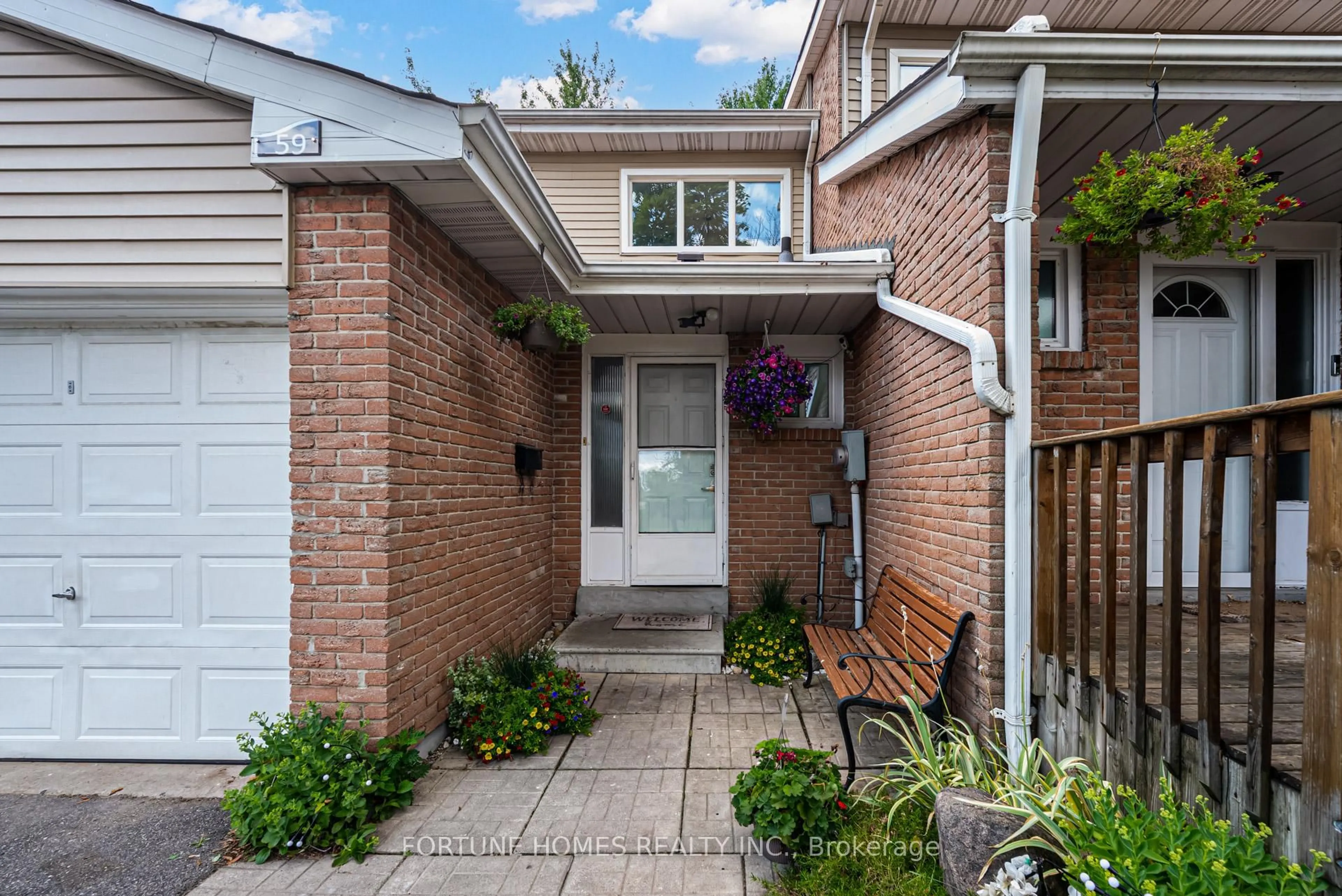 Home with brick exterior material, street for 59 Enmount Dr #59, Brampton Ontario L6T 4C9